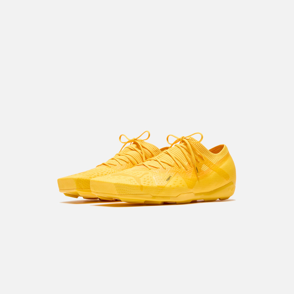 Puma black and yellow shoes deals