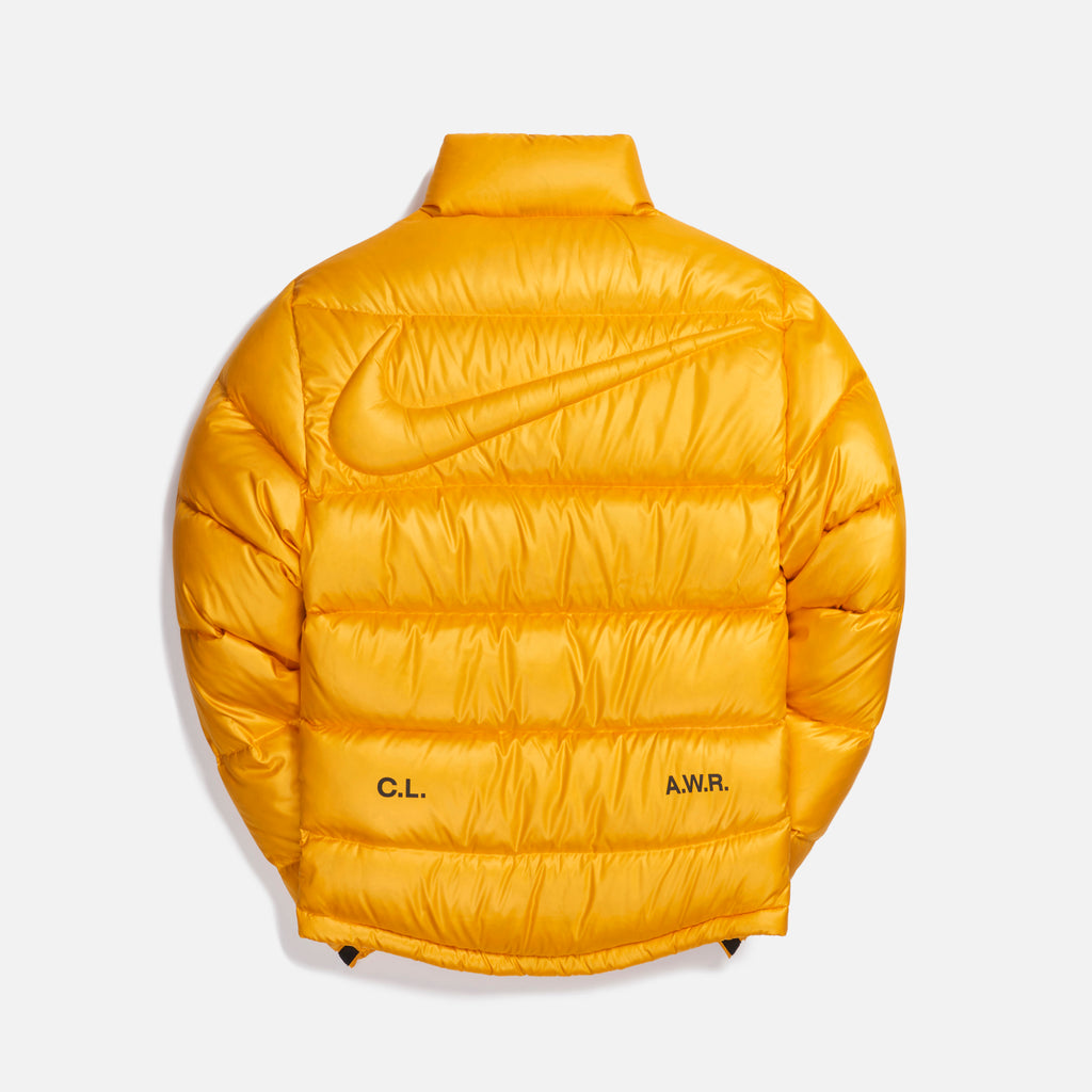 Nike x Drake Nocta Puffer Jacket University Gold Kith