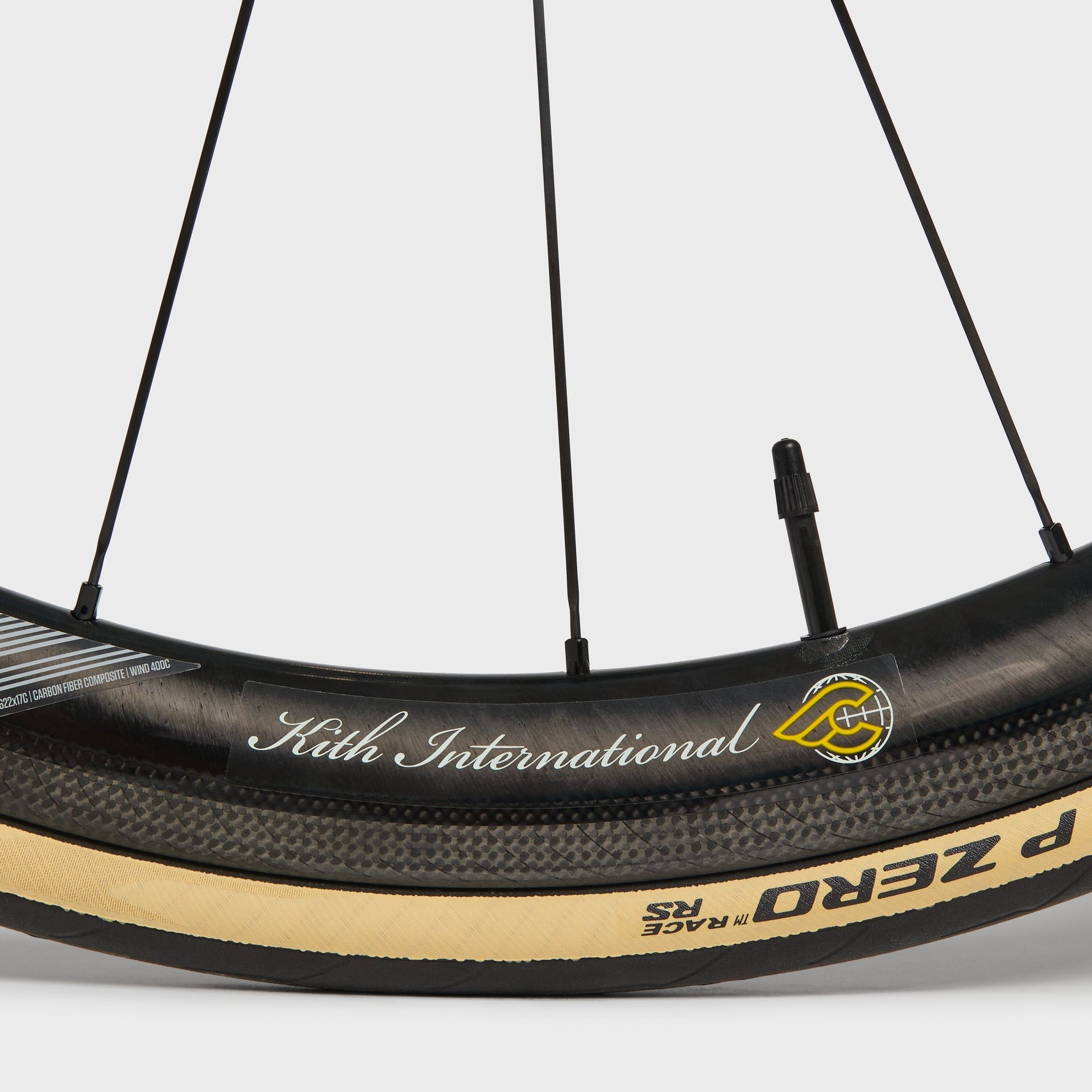 Kith for Cinelli Supercorsa Stadium bike, carbon rim with Kith International decal on a Pirelli P Zero Race tan-wall tire