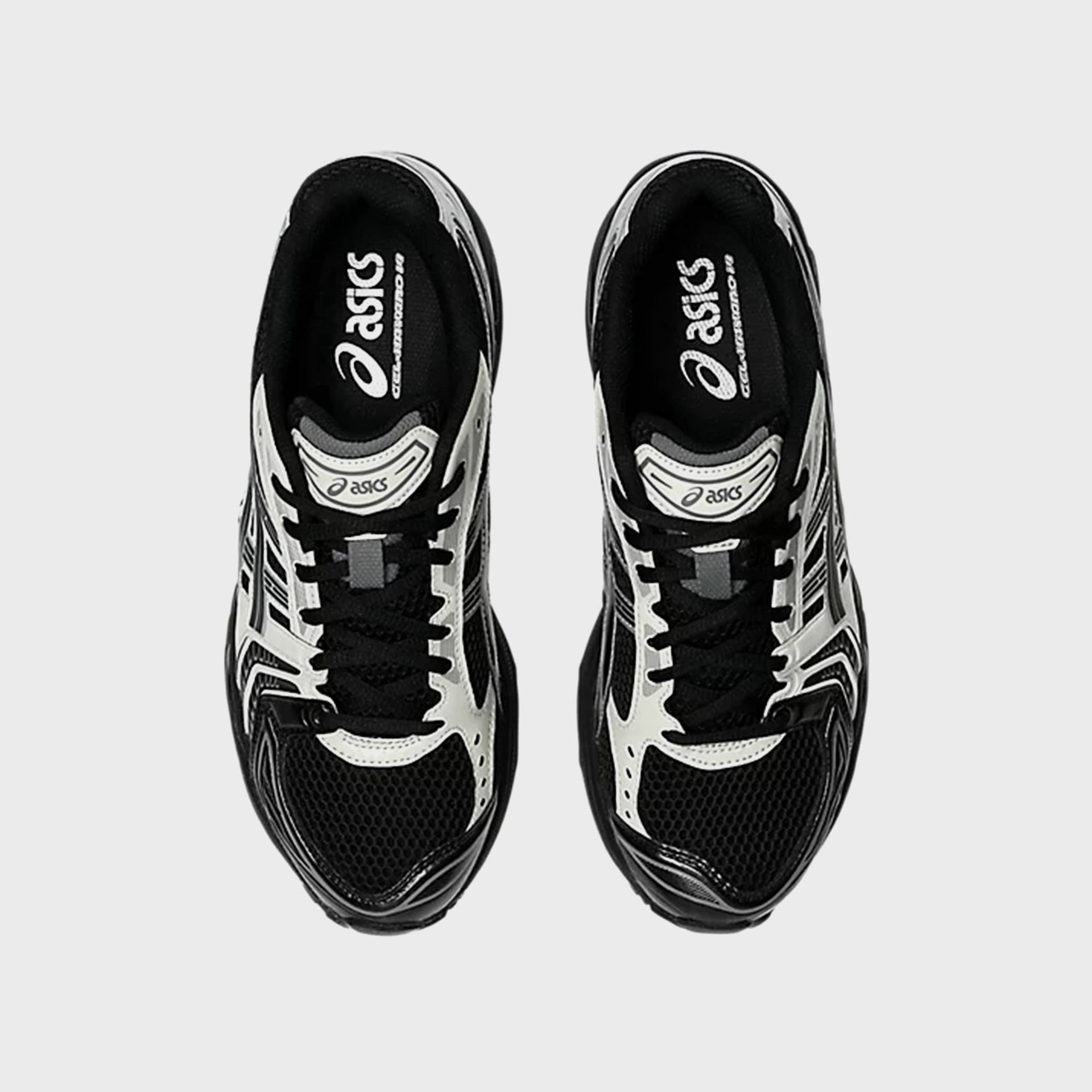 ASICS GEL-KAYANO 14 in Black and Cream, top-down view showing branded insoles