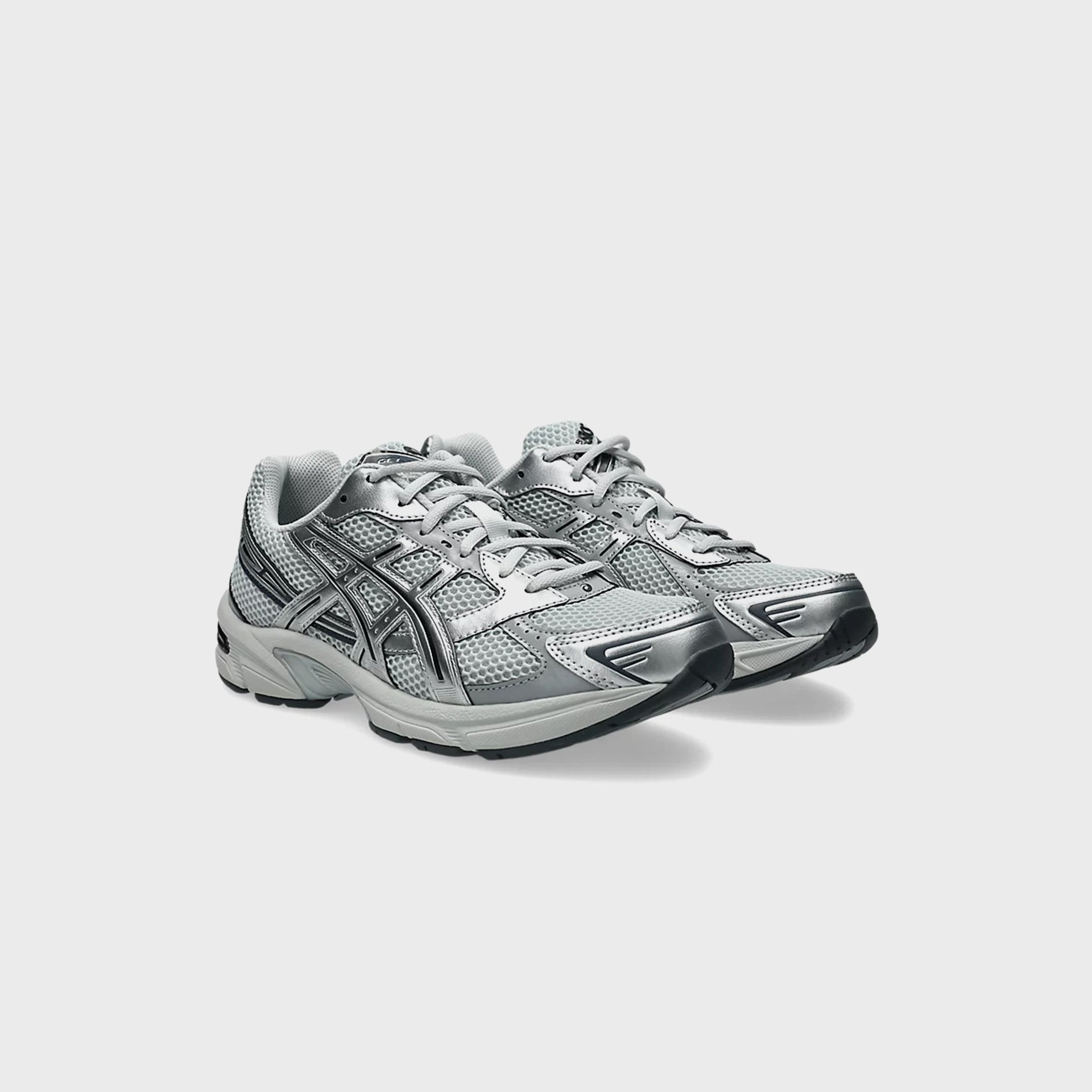 ASICS GEL-1130 in Glacier Grey and Pure Silver, front three-quarter view of pair with mesh upper
