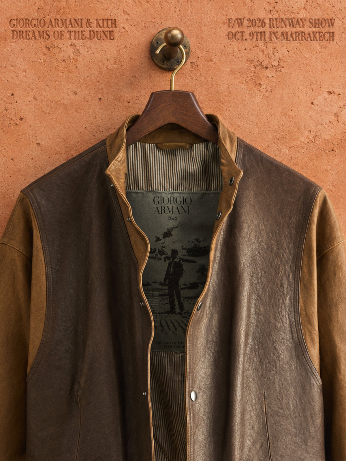 Giorgio Armani x Kith leather jacket with tan suede trim and striped lining, Armani Kith label inside, hung on brass hook, Marrakech show