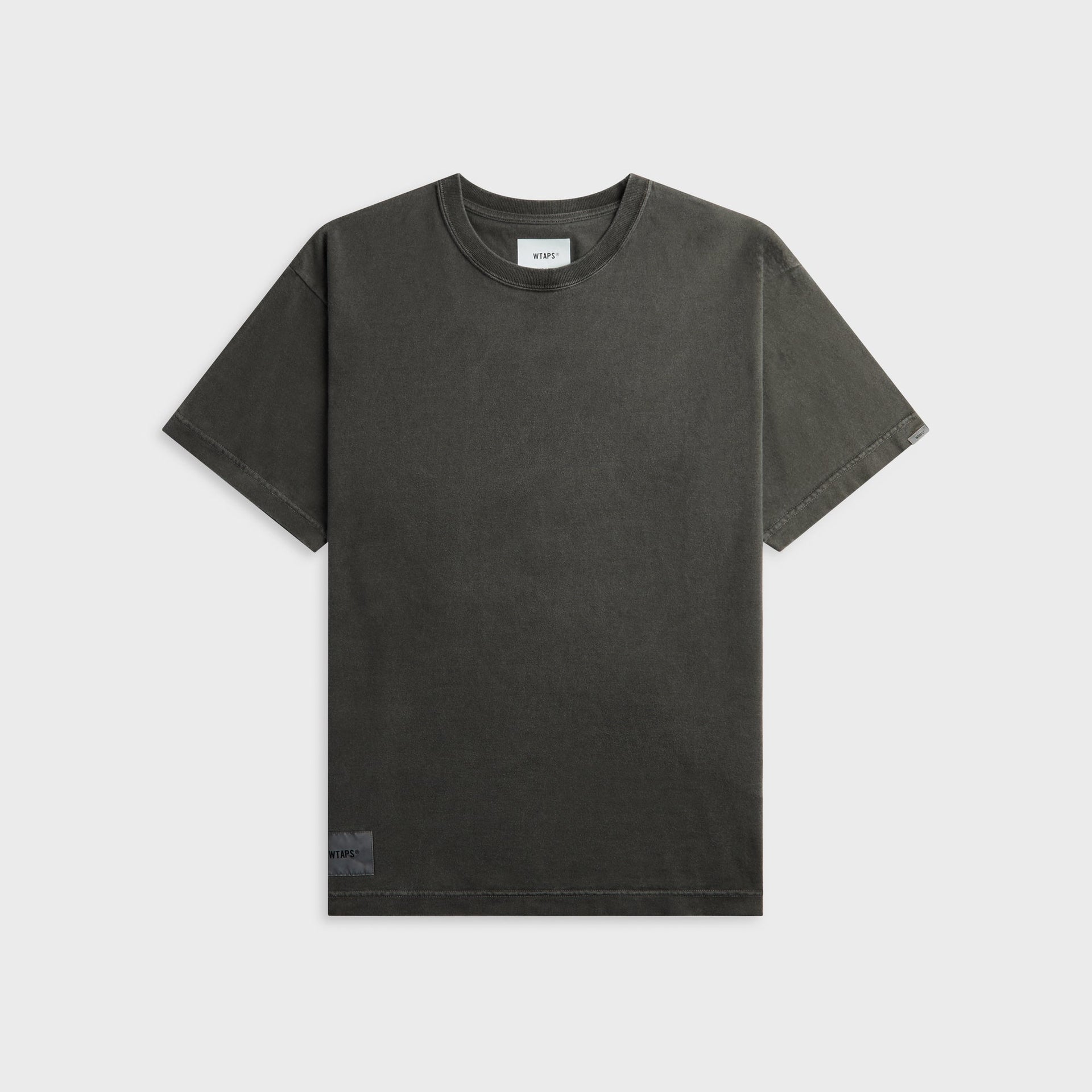 WTAPS Sign-OD short sleeve cotton tee in faded black with small chest logo label, front view, flat lay