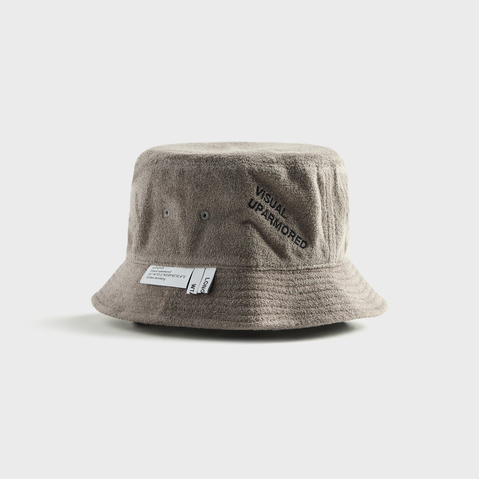 WTAPS 03 grey cotton pile bucket hat with 'Visual Uparmored' embroidered graphic, angled view