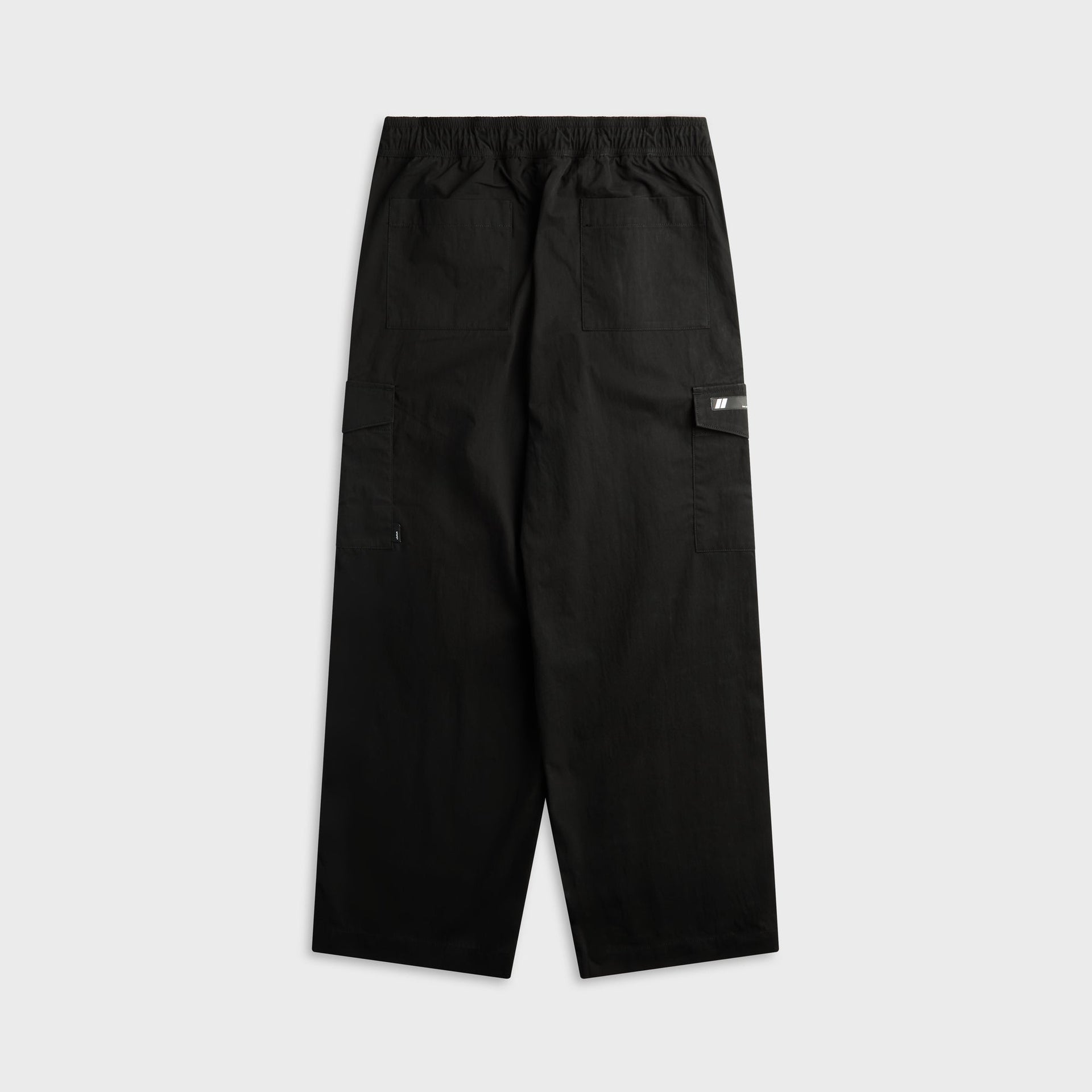 WTAPS MILT2602 black nyco weather trouser, back view with patch pockets, flat lay
