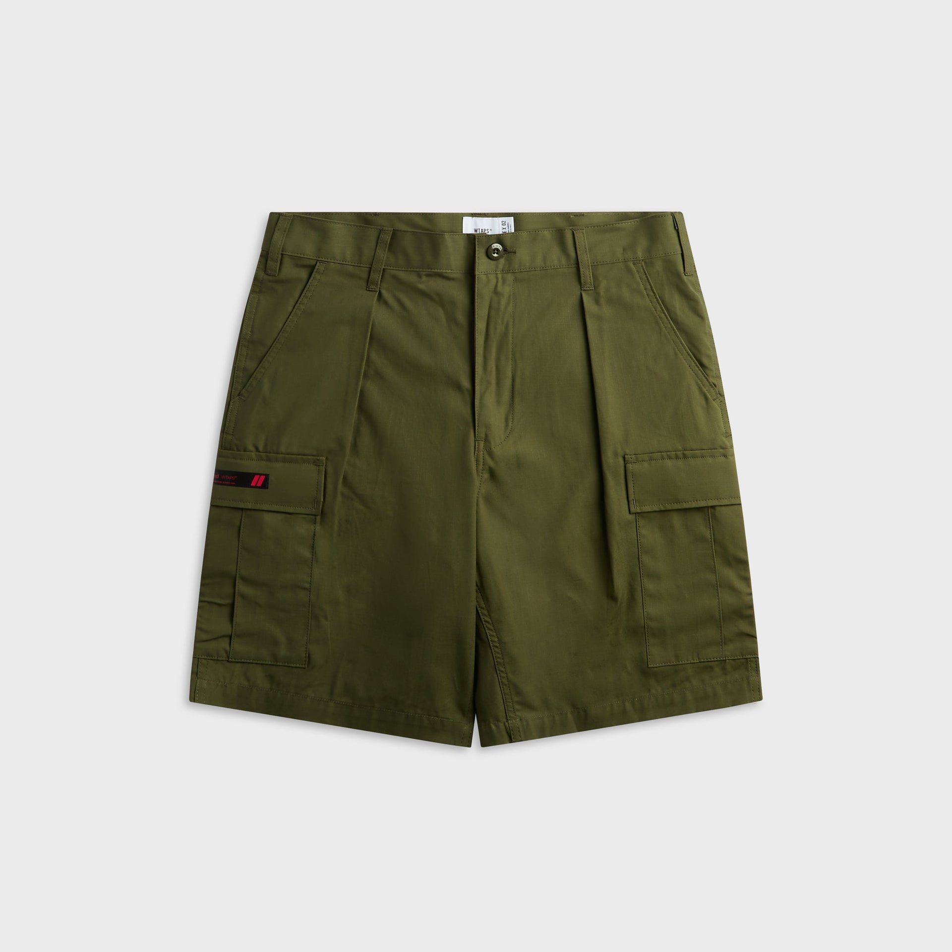 WTAPS MILS9601 olive drab cotton ripstop cargo short with pleated front and side cargo pockets, front view, flat lay