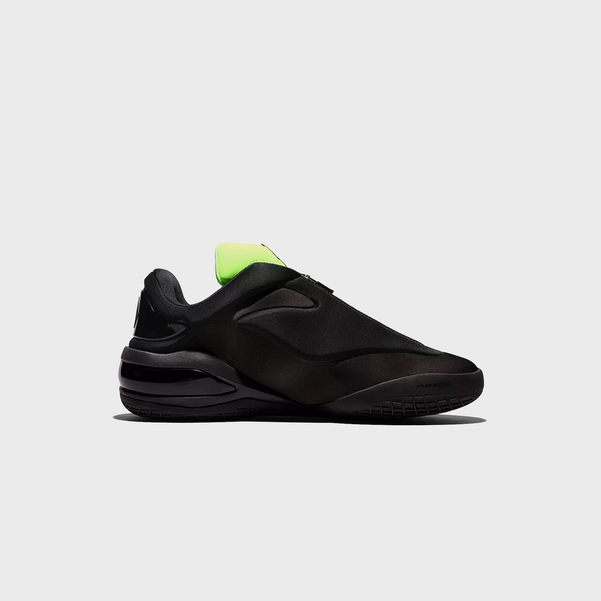 Converse SHAI 001 Ox sneaker in black with green beam heel tab, side profile view