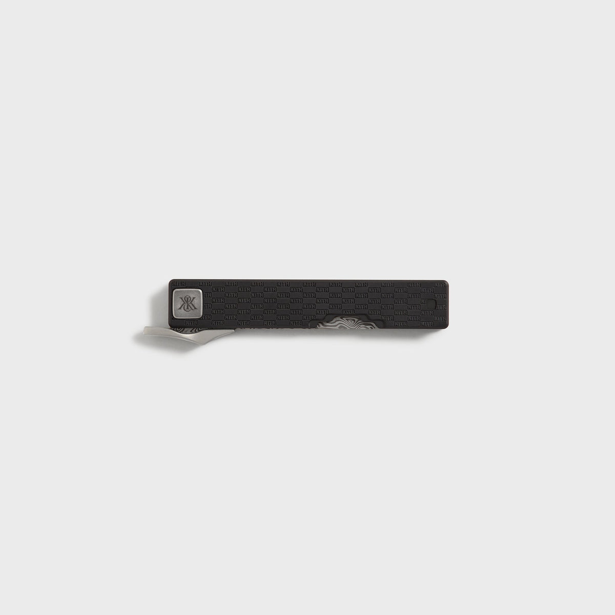 Kith x Benchmade Yamori Black knife closed, pocket clip and Damascus blade tip showing along the black titanium handle