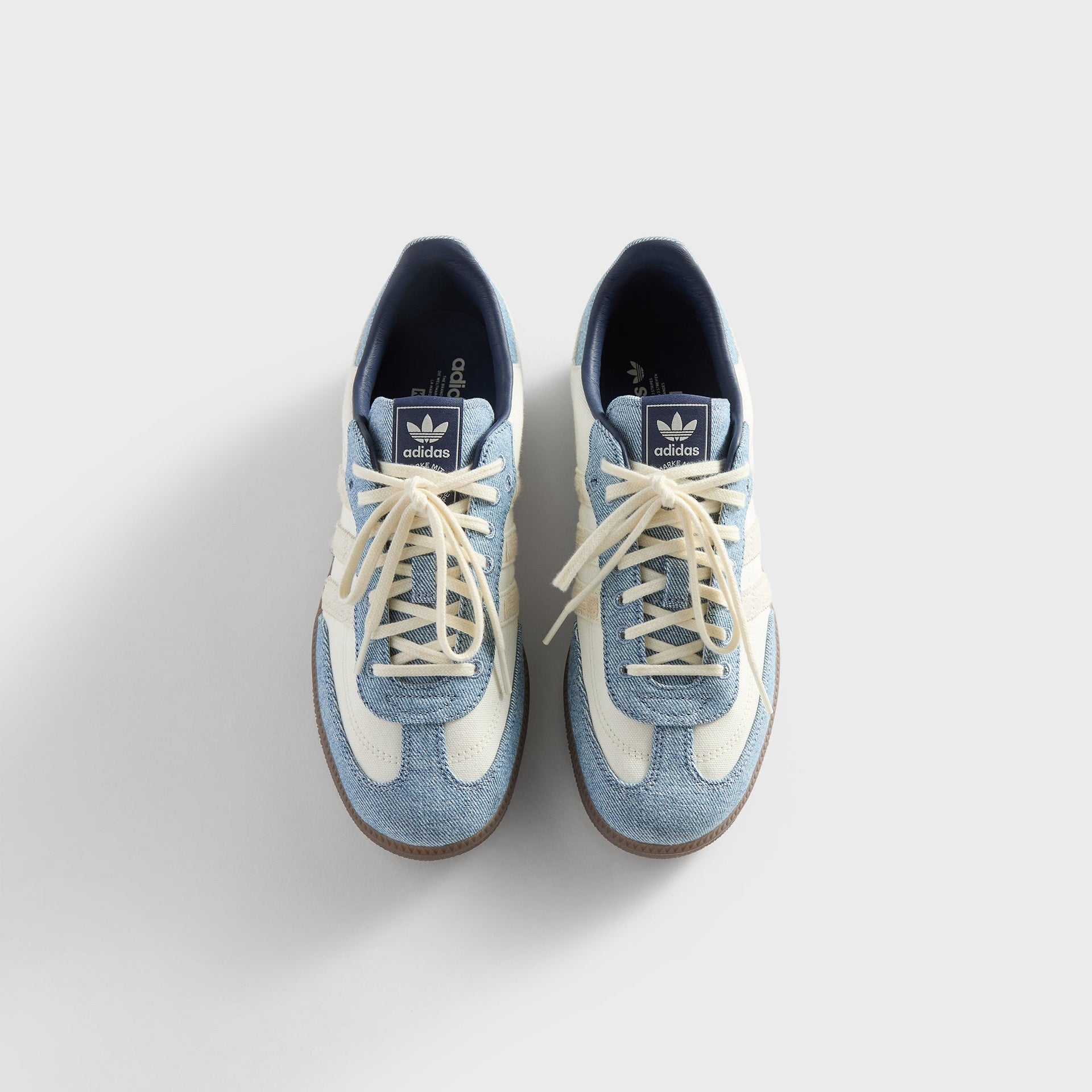Top-down view of Kith for adidas Originals Samba "Denim" sneakers with cream laces and adidas tongue tabs