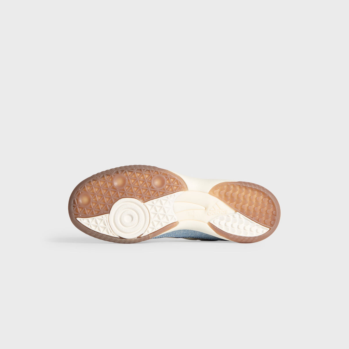 Kith for adidas Football Supernova Indoor in Denim/Gum, bottom view of the gum rubber outsole with adidas branding