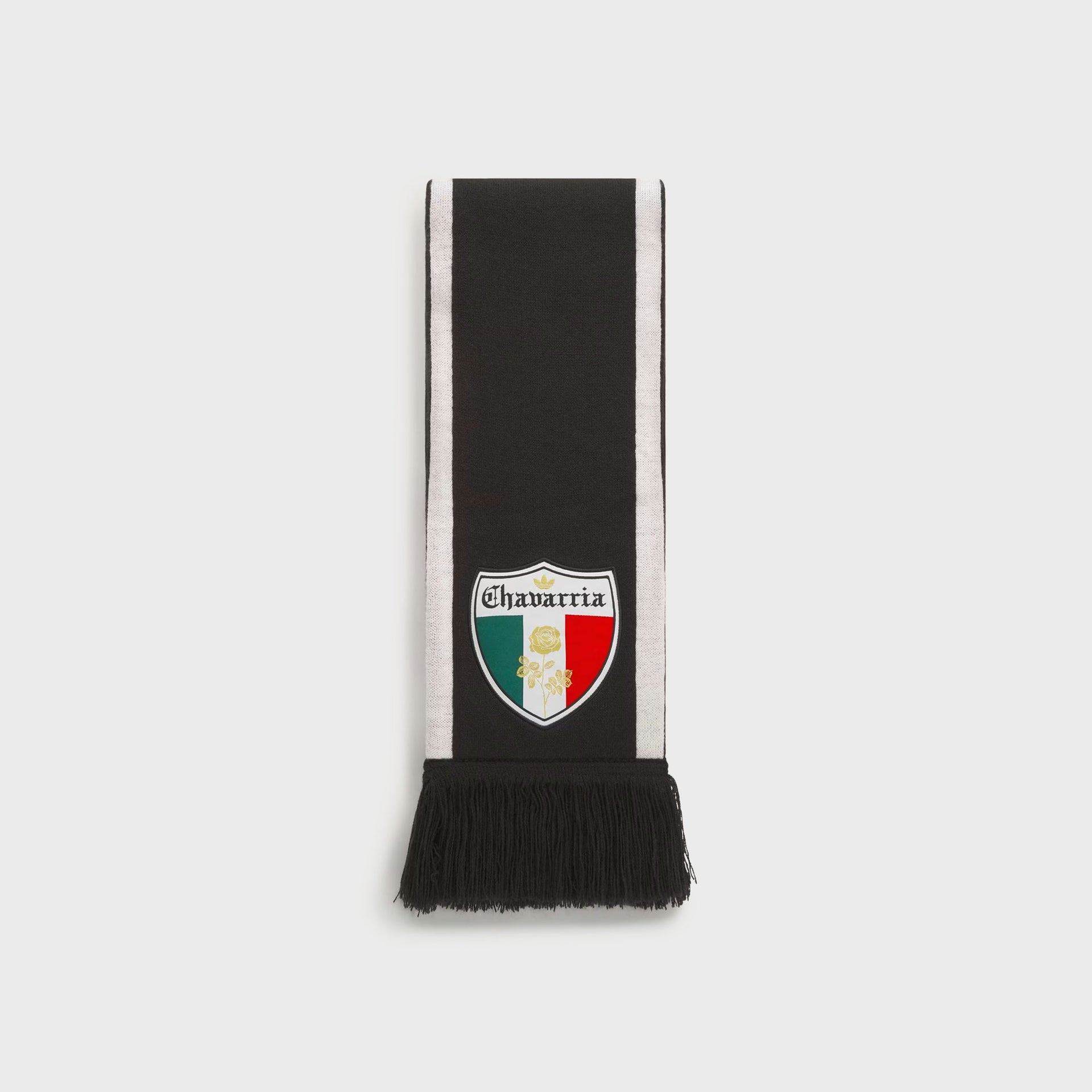 adidas x Willy Chavarria black knit soccer scarf, full view, white side stripes, fringe ends, Chavarria crest over green-white-red flag