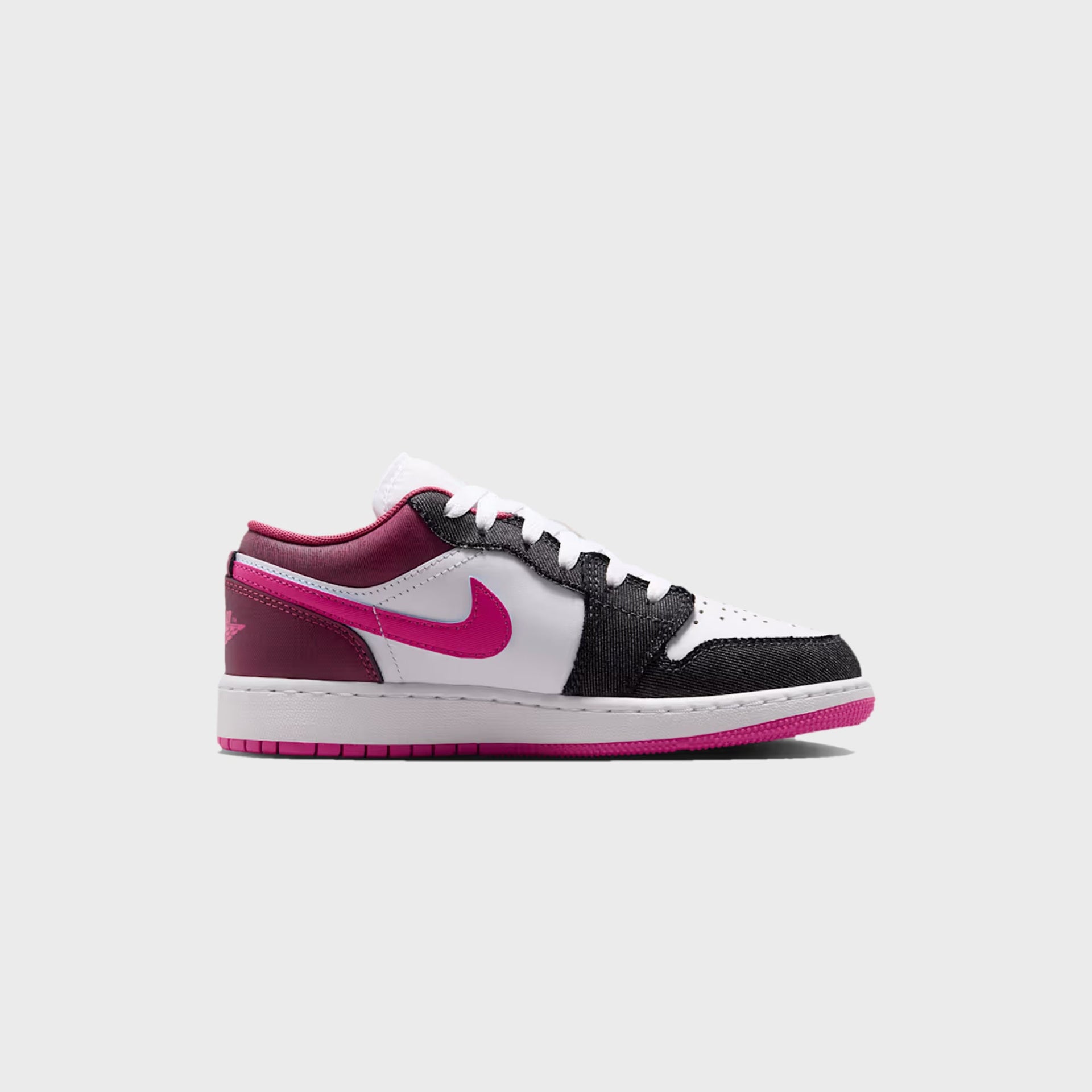 GS Air Jordan 1 Low SE lateral profile — white leather, black denim overlays and fuchsia Swoosh on pink sole