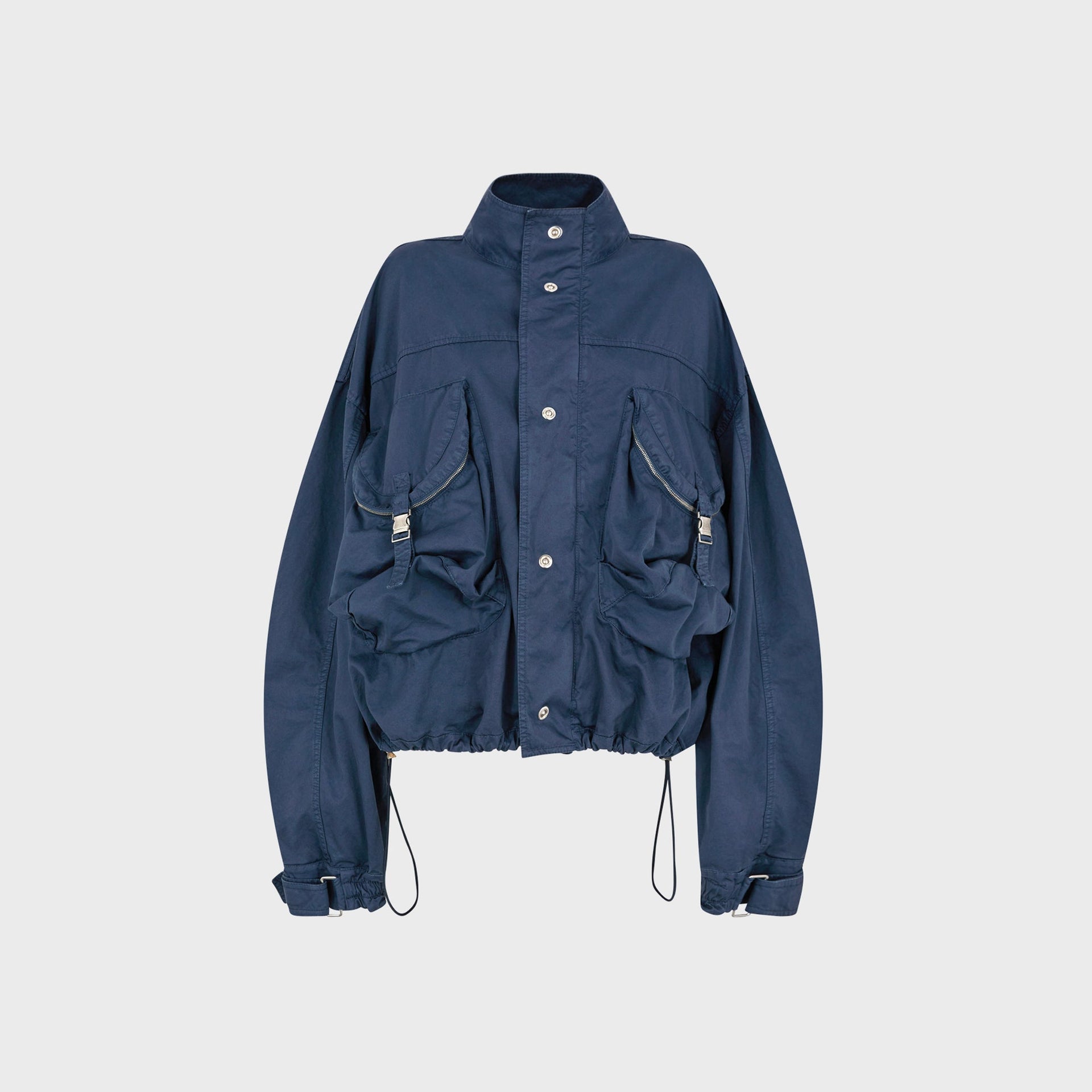 The Attico washed blue cotton bomber jacket, oversized, stand collar, zip cargo pockets, drawcord hem, front flat-lay