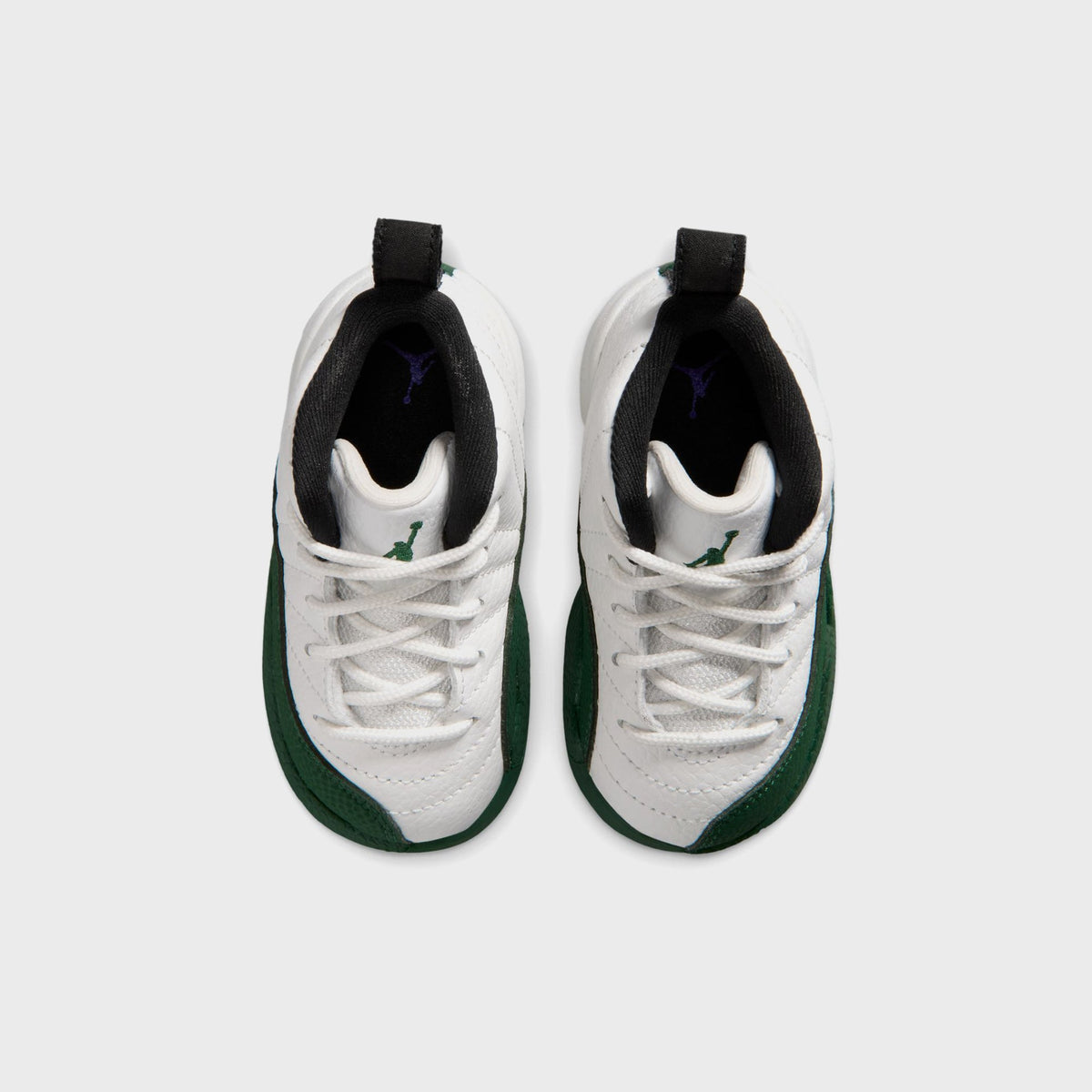 Top-down view of Jordan TD Air Jordan 12 Retro toddler pair showing purple Jordan Wings embroidery on the tongue
