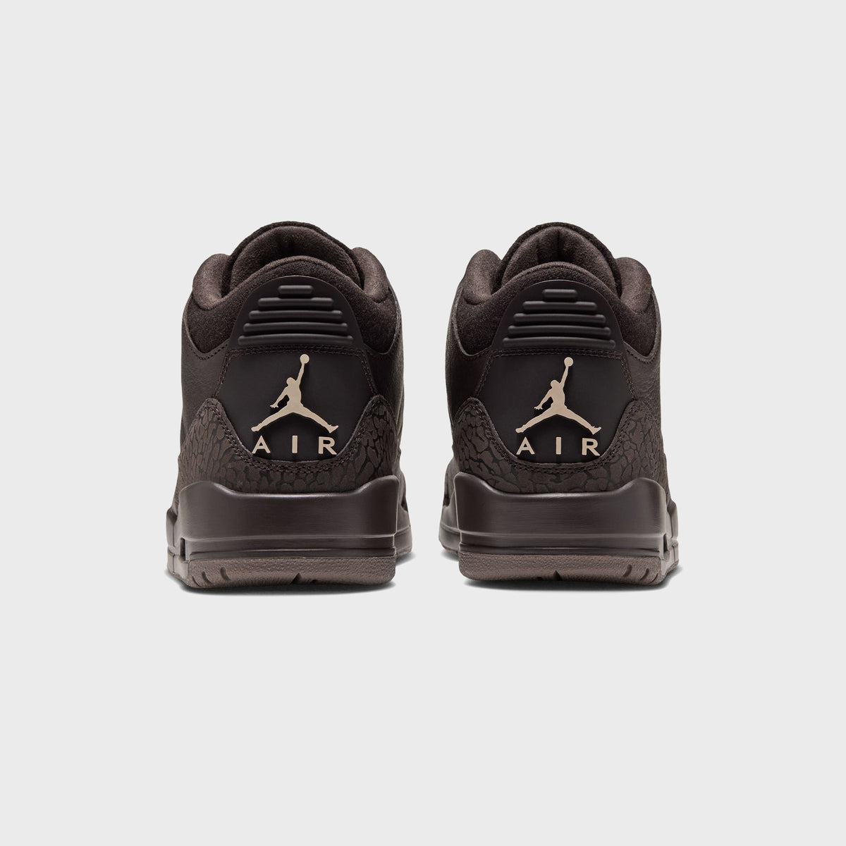 Jordan WMNS Air Jordan 3 Velvet Brown pair, rear view with tan Jumpman Air heel logos and elephant print overlays