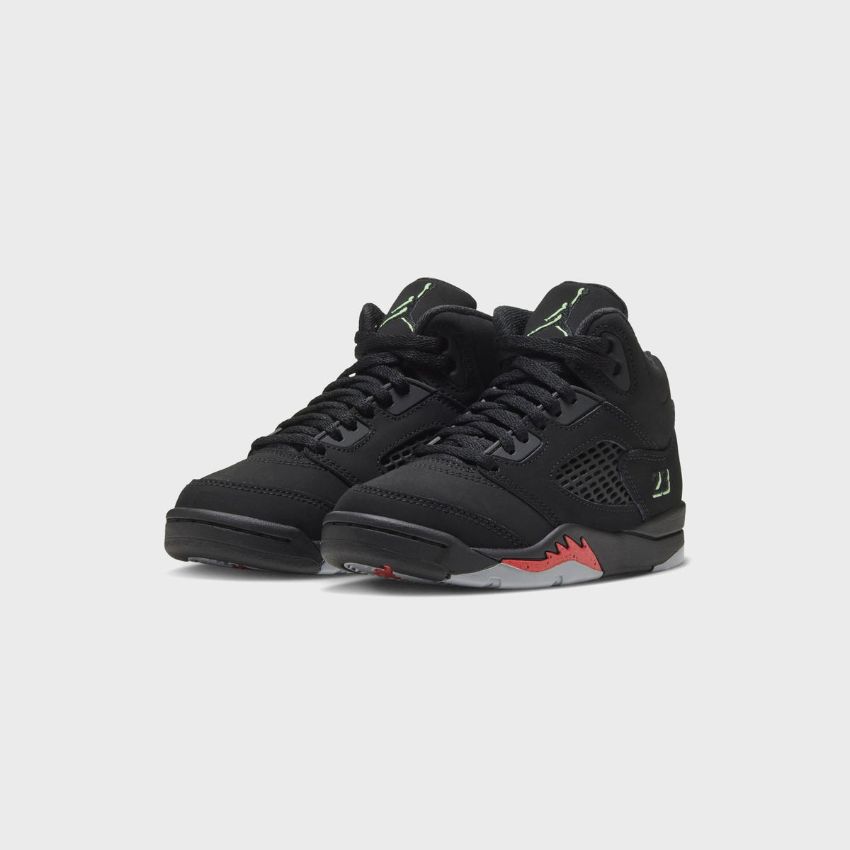 Pair of Jordan PS Jordan 5 Retro black nubuck sneakers, three-quarter front view with green Jumpman tongue logos