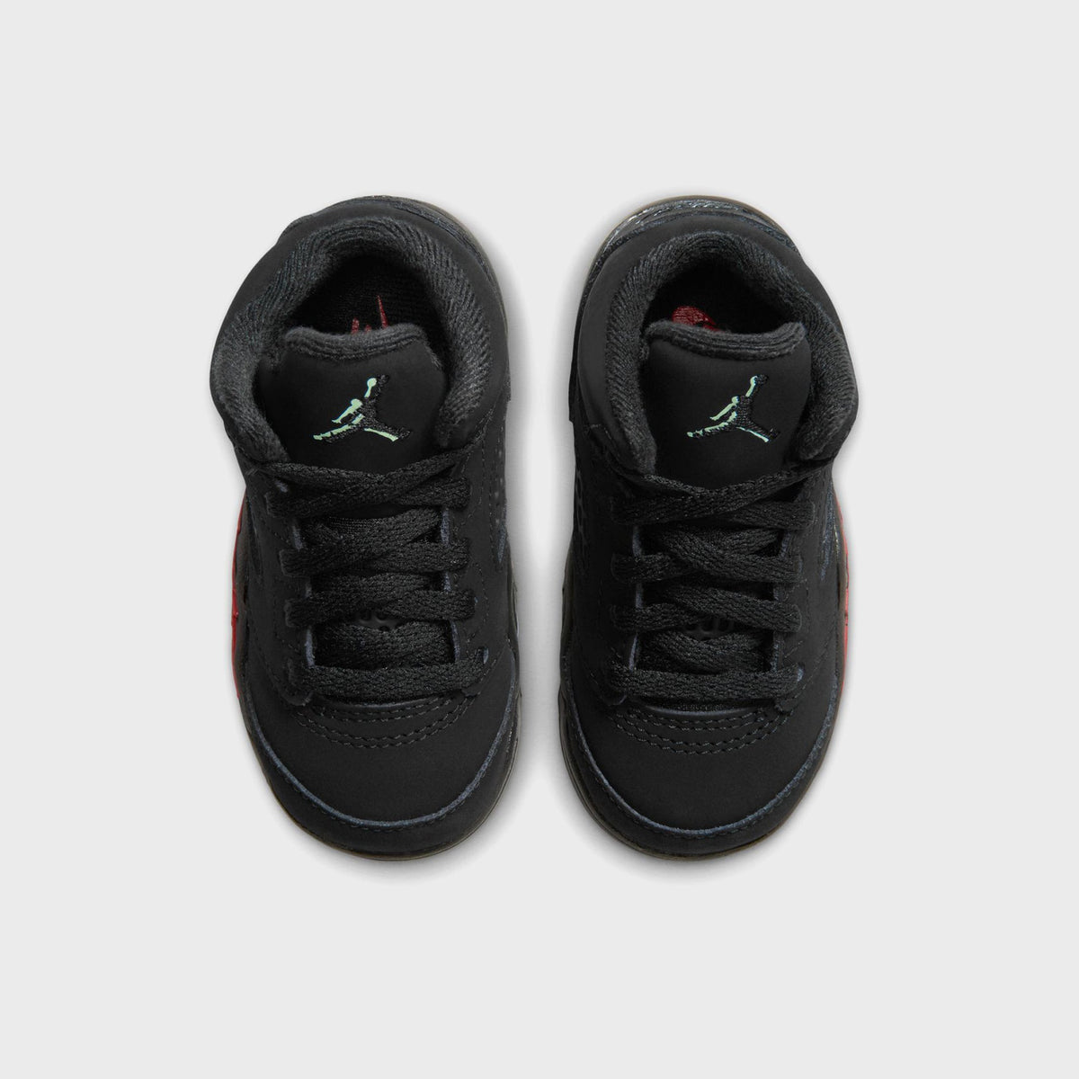 Top-down view of Jordan TD Jordan 5 Retro black nubuck showing laces and mint Jumpman tongue logo