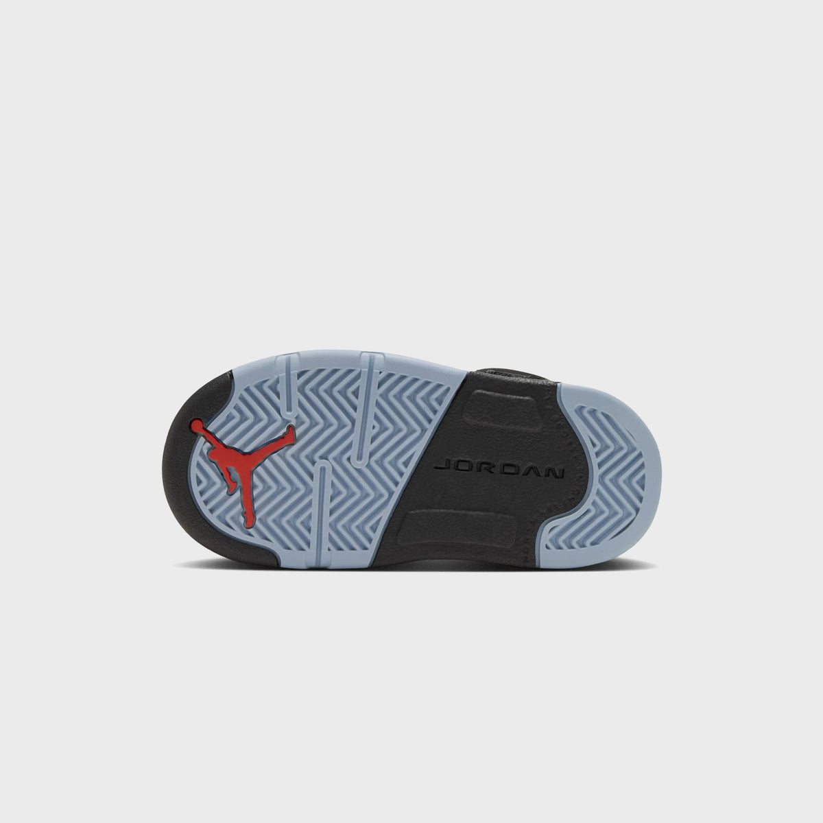 Outsole of Jordan TD Jordan 5 Retro with red Jumpman logo and icy blue herringbone tread