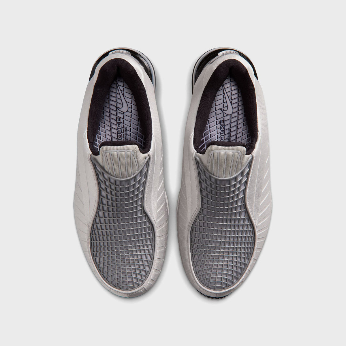 Nike Air Max Dolce sneakers in Metallic Silver and Black, top-down view showing the mesh vamp and branded insole