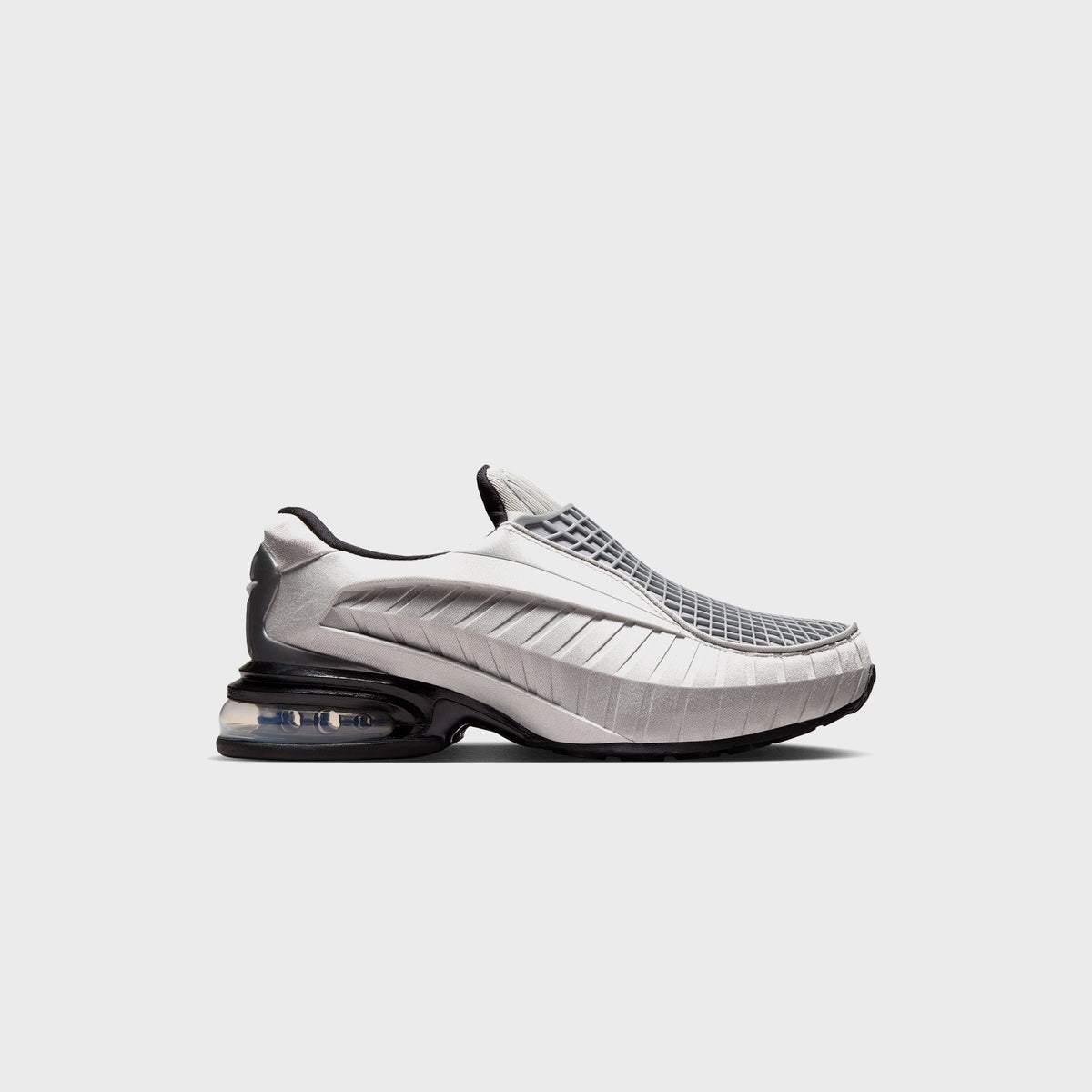 Nike Air Max Dolce sneaker in Metallic Silver and Black, lateral side view showing the ribbed toe box and visible Air unit heel