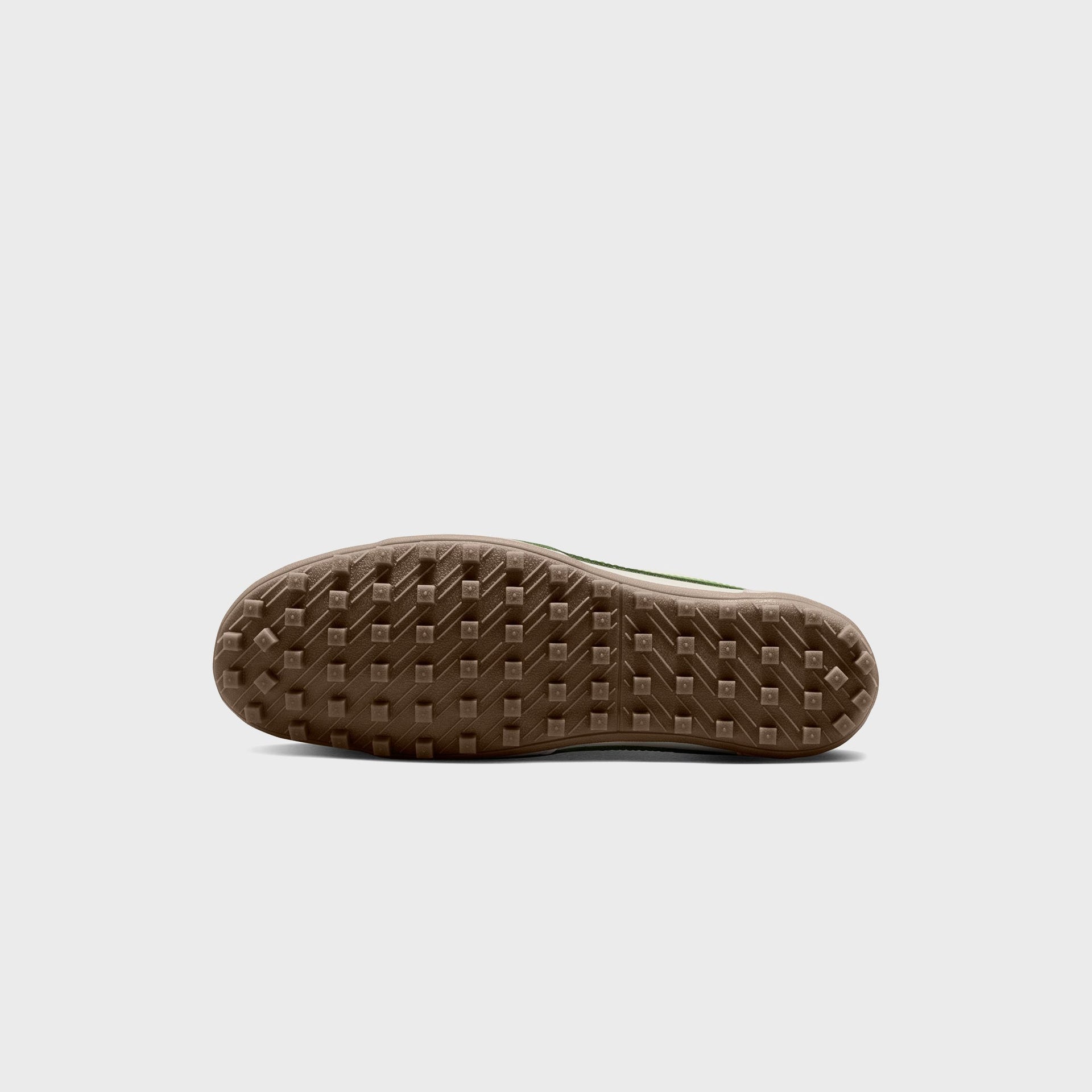 Nike WMNS Moon Shoe underside view showing the tan gum rubber waffle-stud outsole