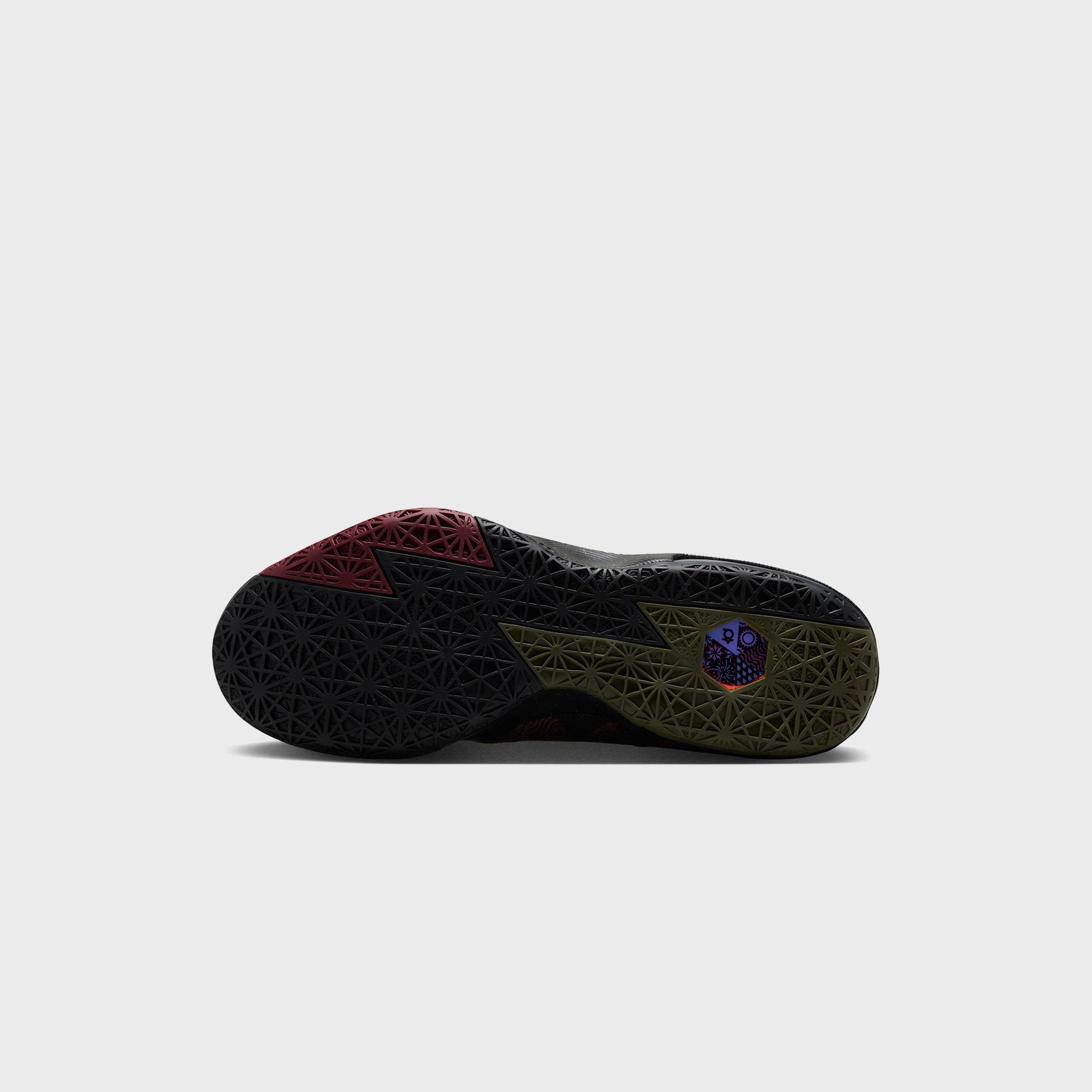 Nike KD 6 basketball shoe outsole showing maroon, black and olive triangular traction pattern