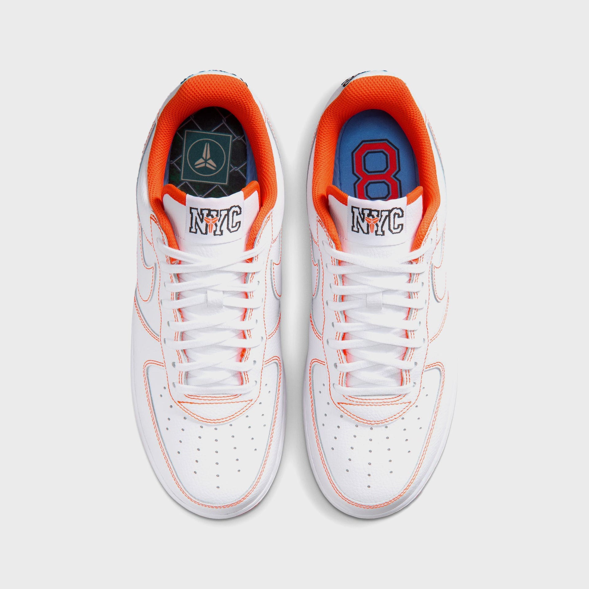 Overhead view of the Nike AF1 Low Protro NYC pair with orange linings, a Kobe sheath insole and a blue insole with red number 8