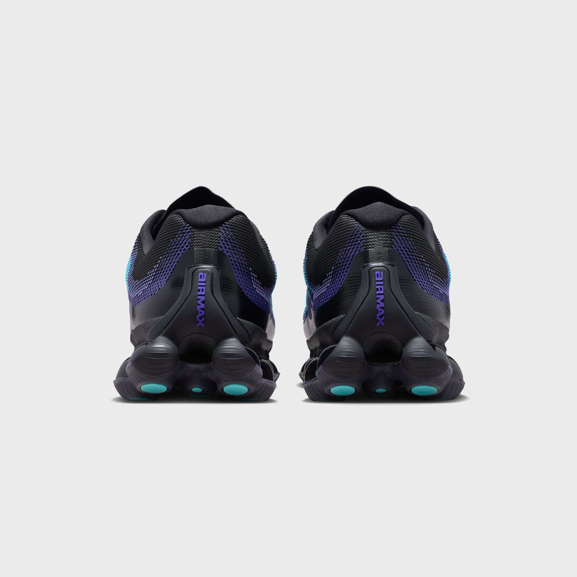 Rear heel view of Nike Air Liquid Max sneakers highlighting the Air Max heel branding and bubbled sole pods