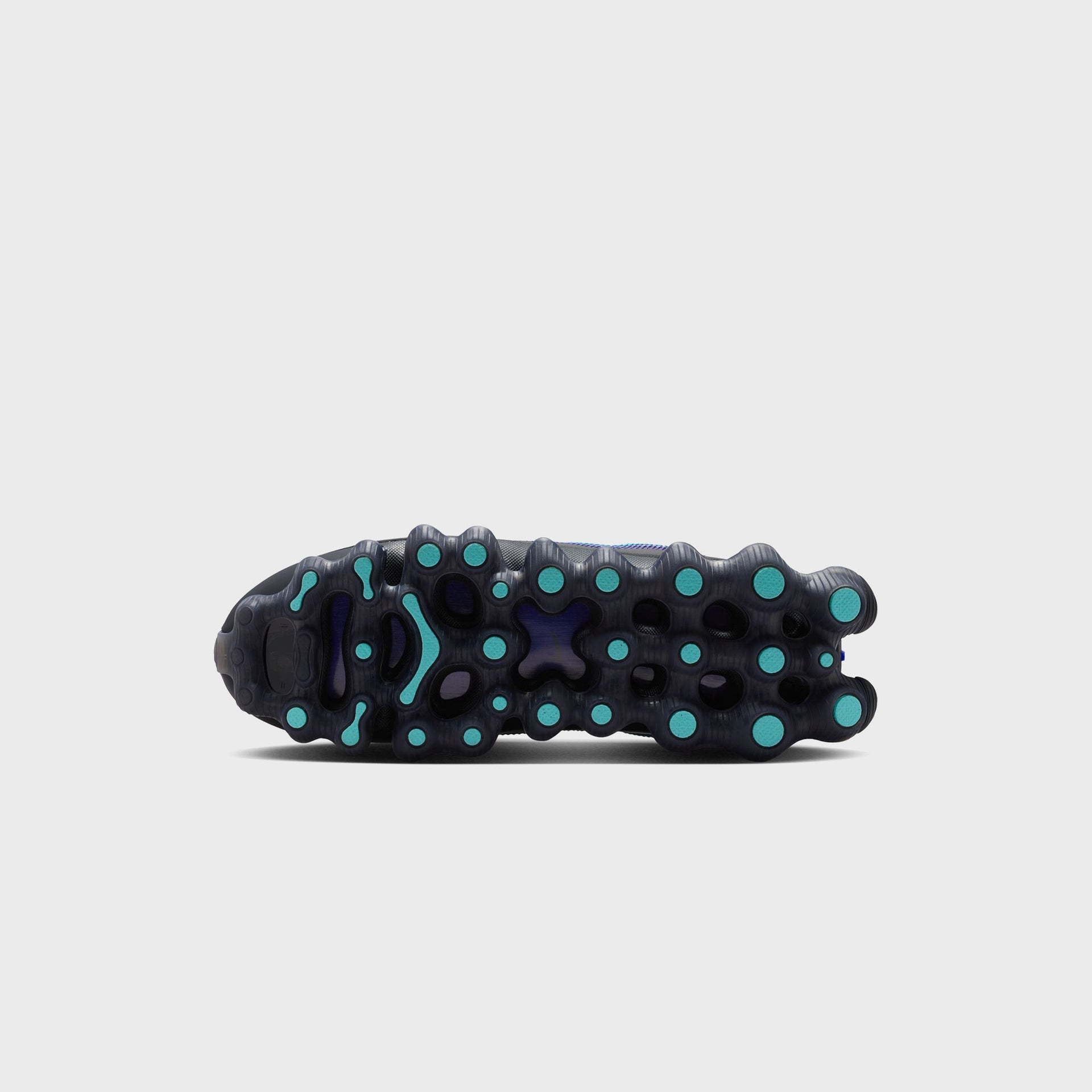 Outsole view of the Nike Air Liquid Max showing its bubbled, teal-dotted Air Max traction pattern