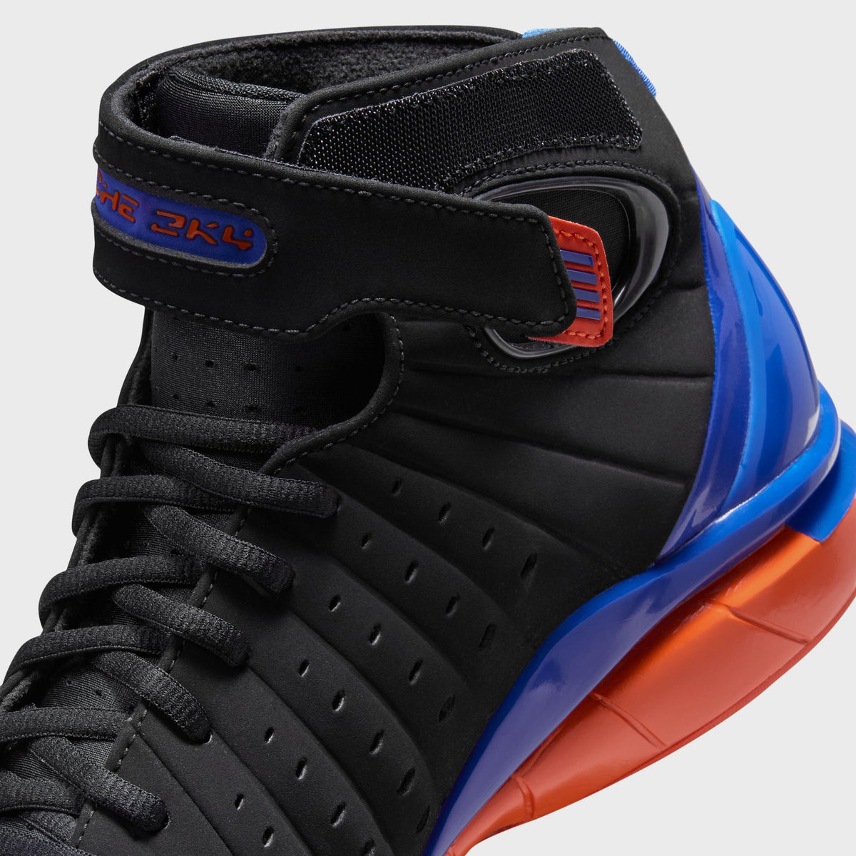 Nike Air Zoom Huarache 2K4 basketball shoe, close-up of the ankle strap and Huarache 2K4 tongue branding