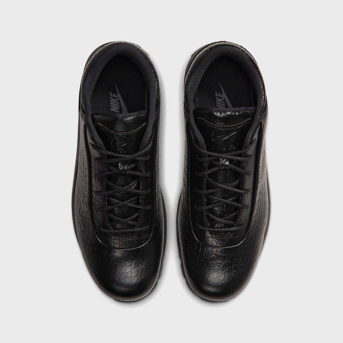 Nike Air Max Goadome Low black, top-down view of pair showing lacing and embossed leather upper
