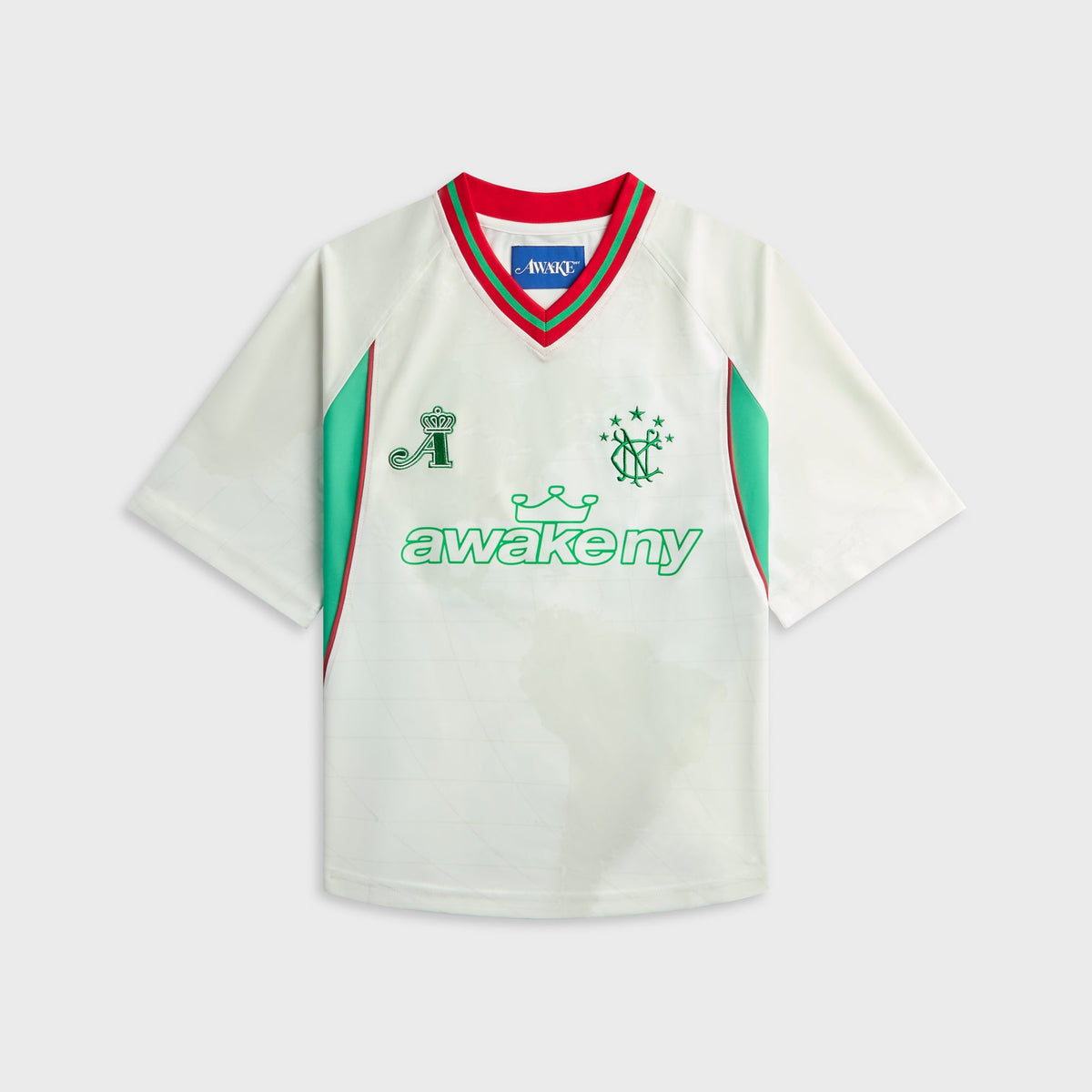 Awake NY Mundial Crown Jersey in White, cream soccer jersey with teal and green crest graphic, front view