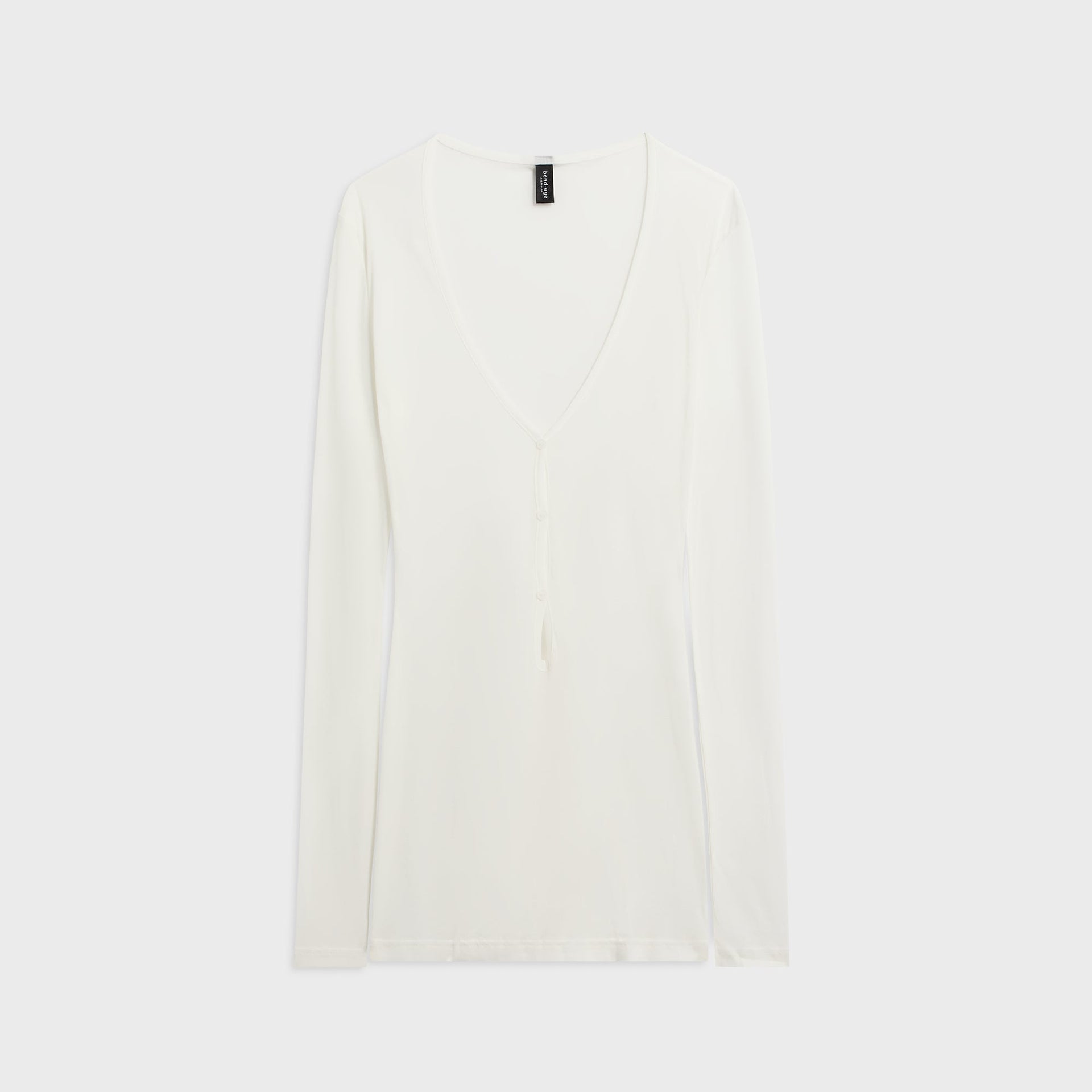 Bond-Eye Elias coconut ivory long-sleeve mini dress, sheer knit with deep V button-tie front, front flat-lay