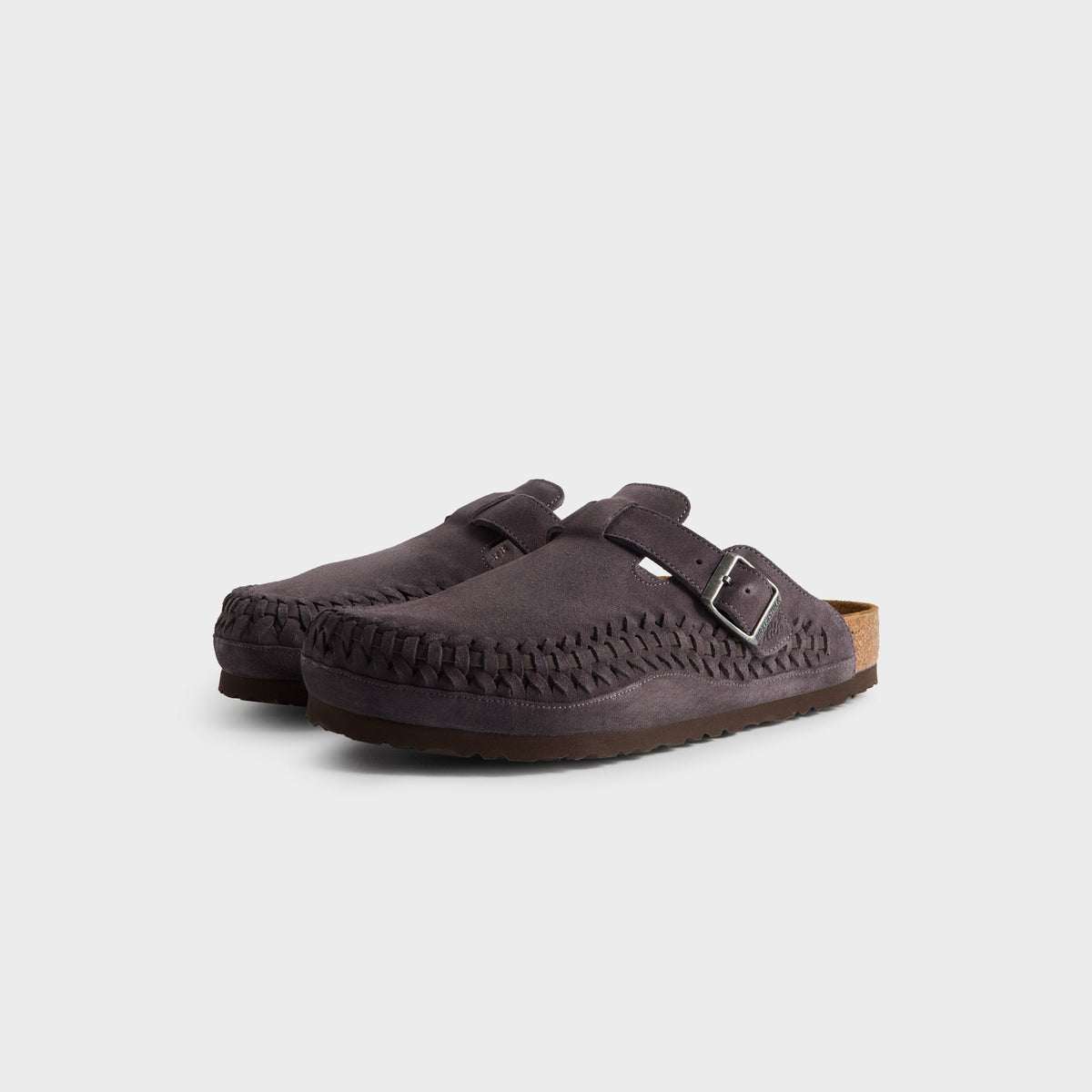 Kith for Birkenstock Boston Braided in Rabbit Grey, front three-quarter view of the charcoal suede clog pair with braided toe edges