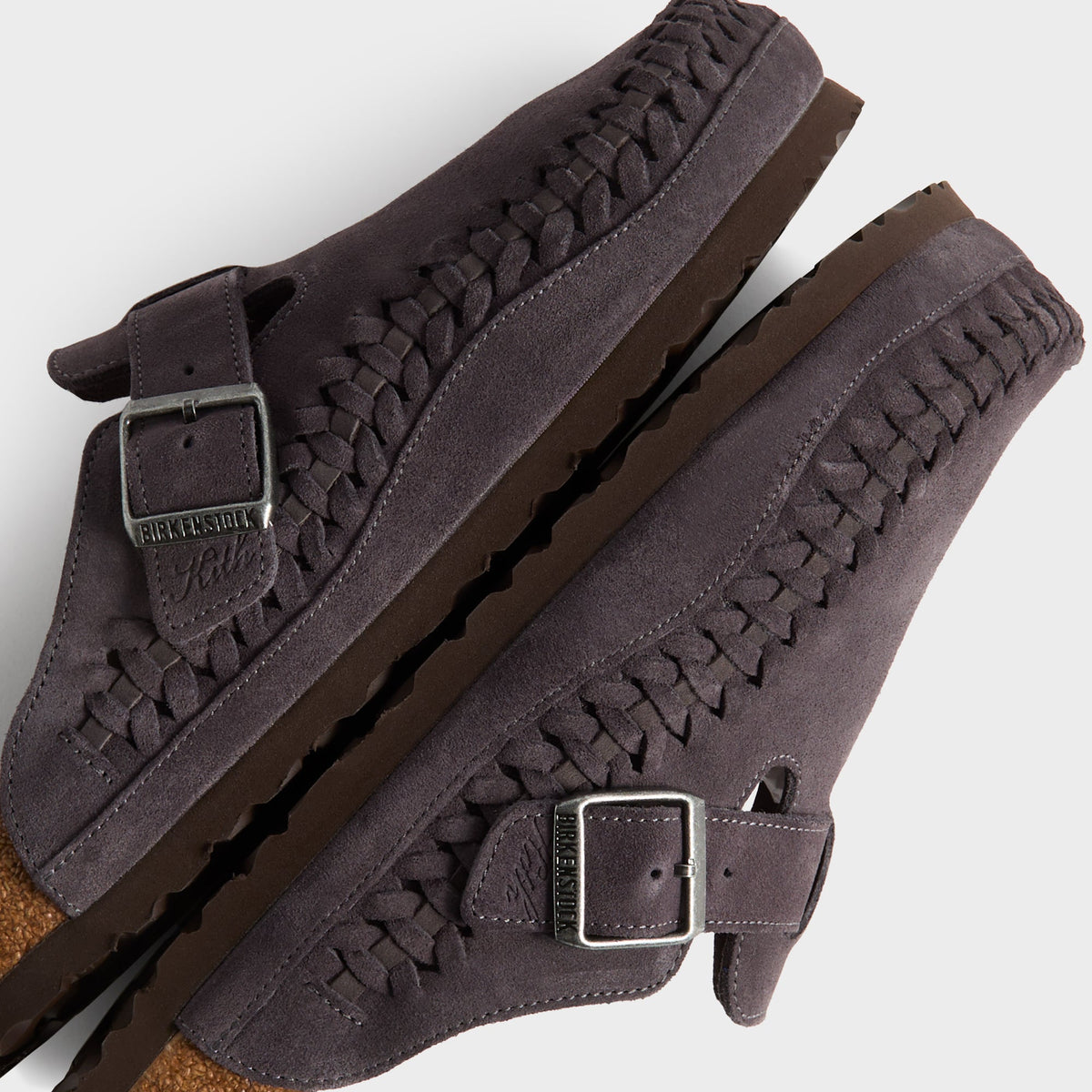 Kith for Birkenstock Boston Braided in Rabbit Grey, detail of stacked clogs showing braided welt and Birkenstock x Kith buckles