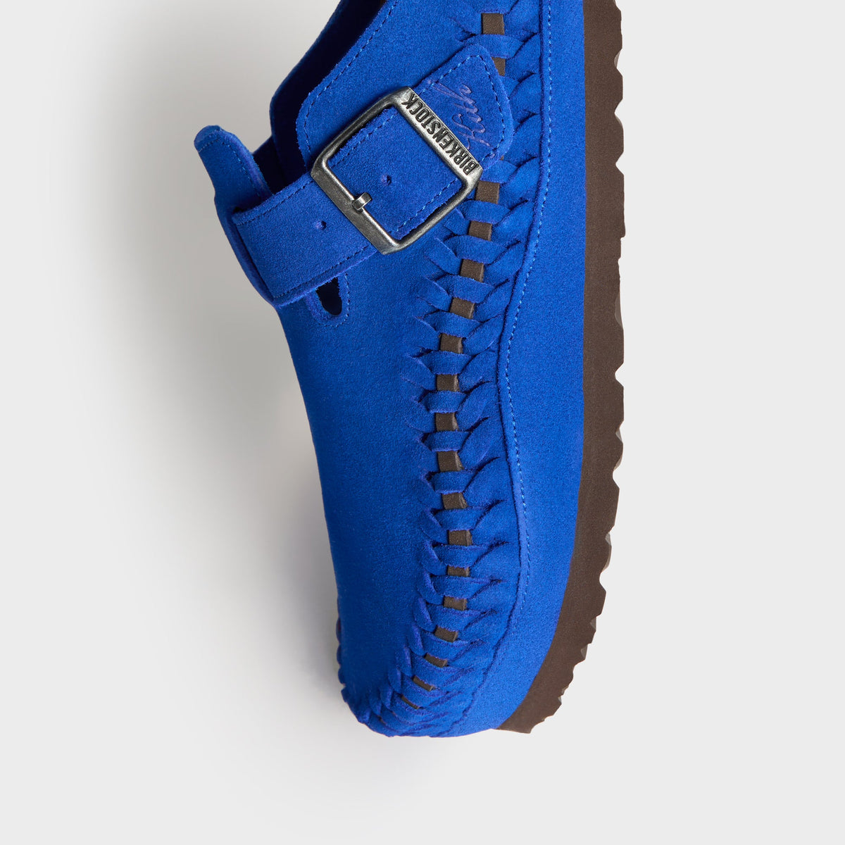 Kith for Birkenstock Women's Boston Braided in Ultra Blue, angled close-up of the buckle strap, braided edge and brown sole