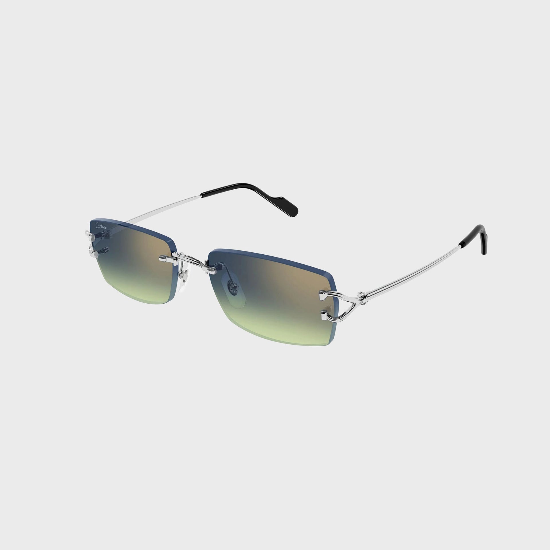 Cartier Decor C rimless rectangular sunglasses with silver C-hinge, blue-to-green gradient lenses and silver arms, angled view