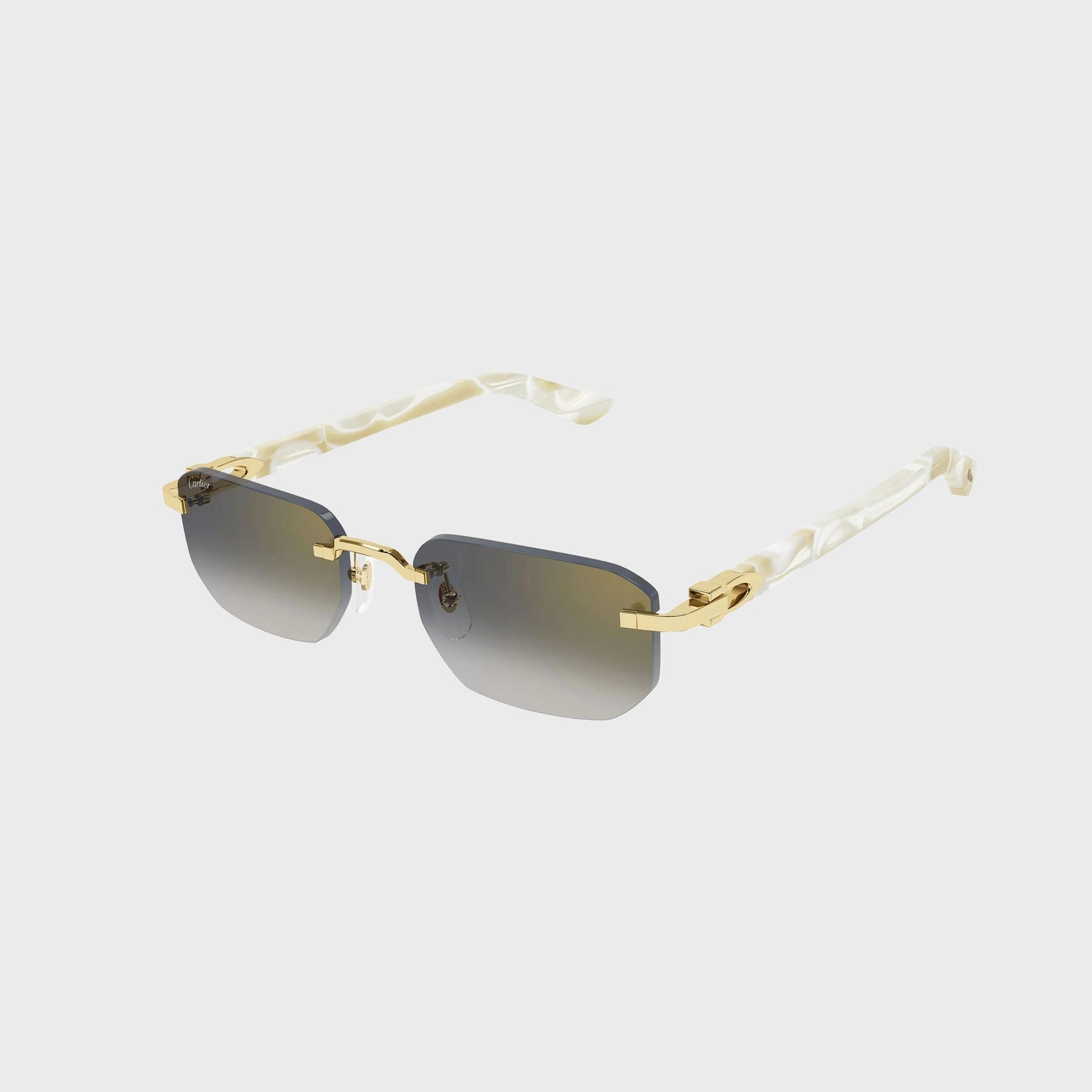 Cartier Decor C rimless rectangular sunglasses, gold hardware and grey gradient lenses with pearl-white temple arms, angled view