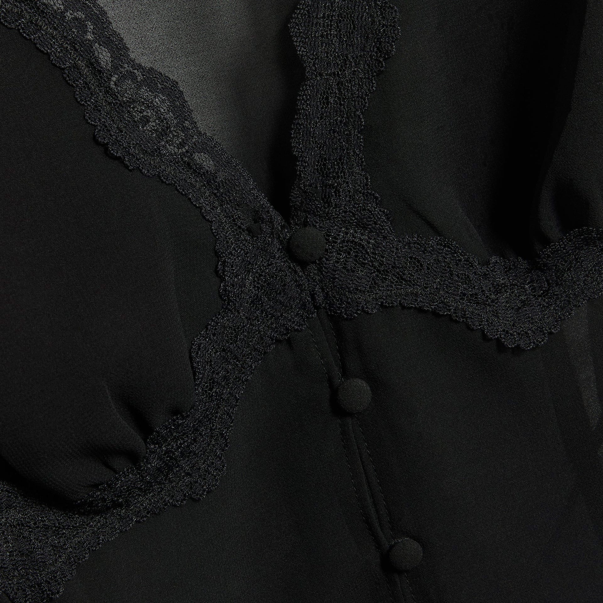 GUIZIO Ara black top detail, scalloped lace trim and fabric-covered buttons on sheer chiffon