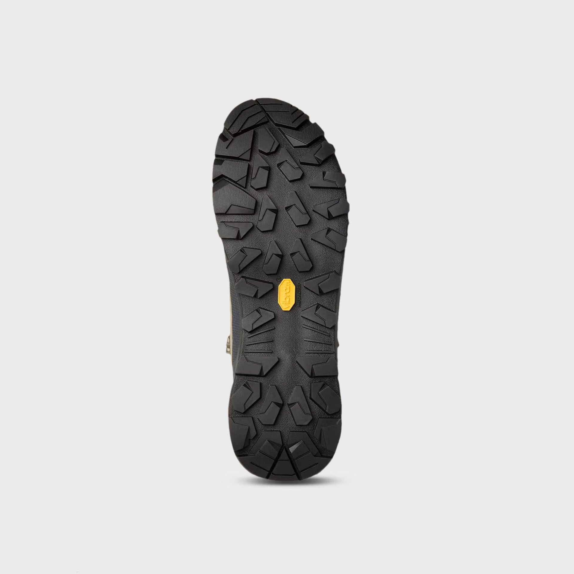 Arc'teryx Konseal Trek mid boot outsole showing black Vibram Megagrip lug tread pattern