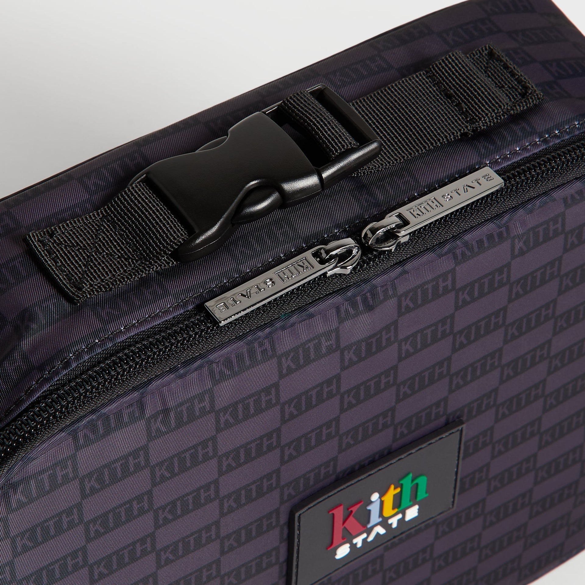 Kith Kids for STATE Rodgers Lunch Box close-up of top buckle handle and Kith State branded zipper pulls
