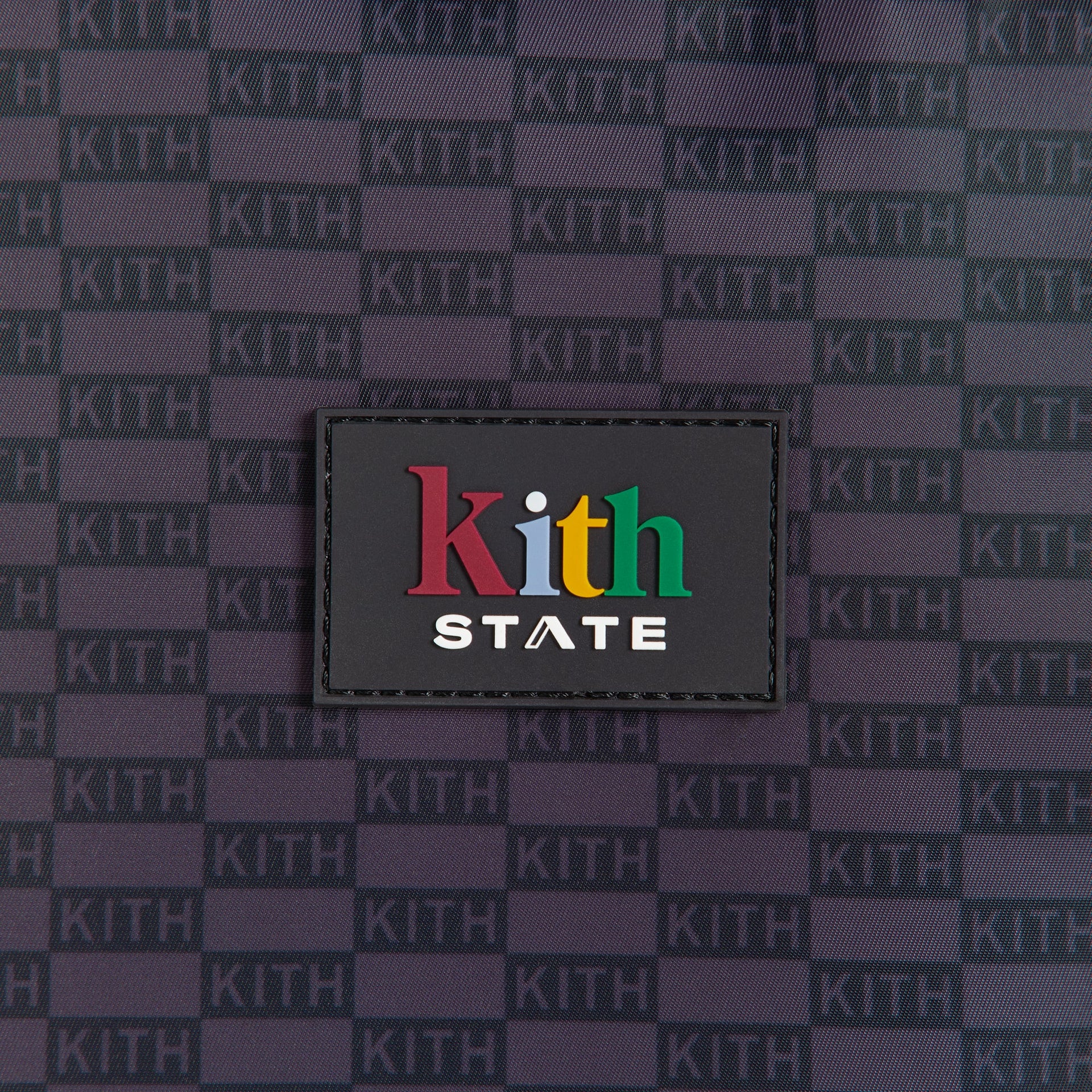 Kith Kids for STATE Kane Backpack, close-up of multicolor Kith State rubber logo patch
