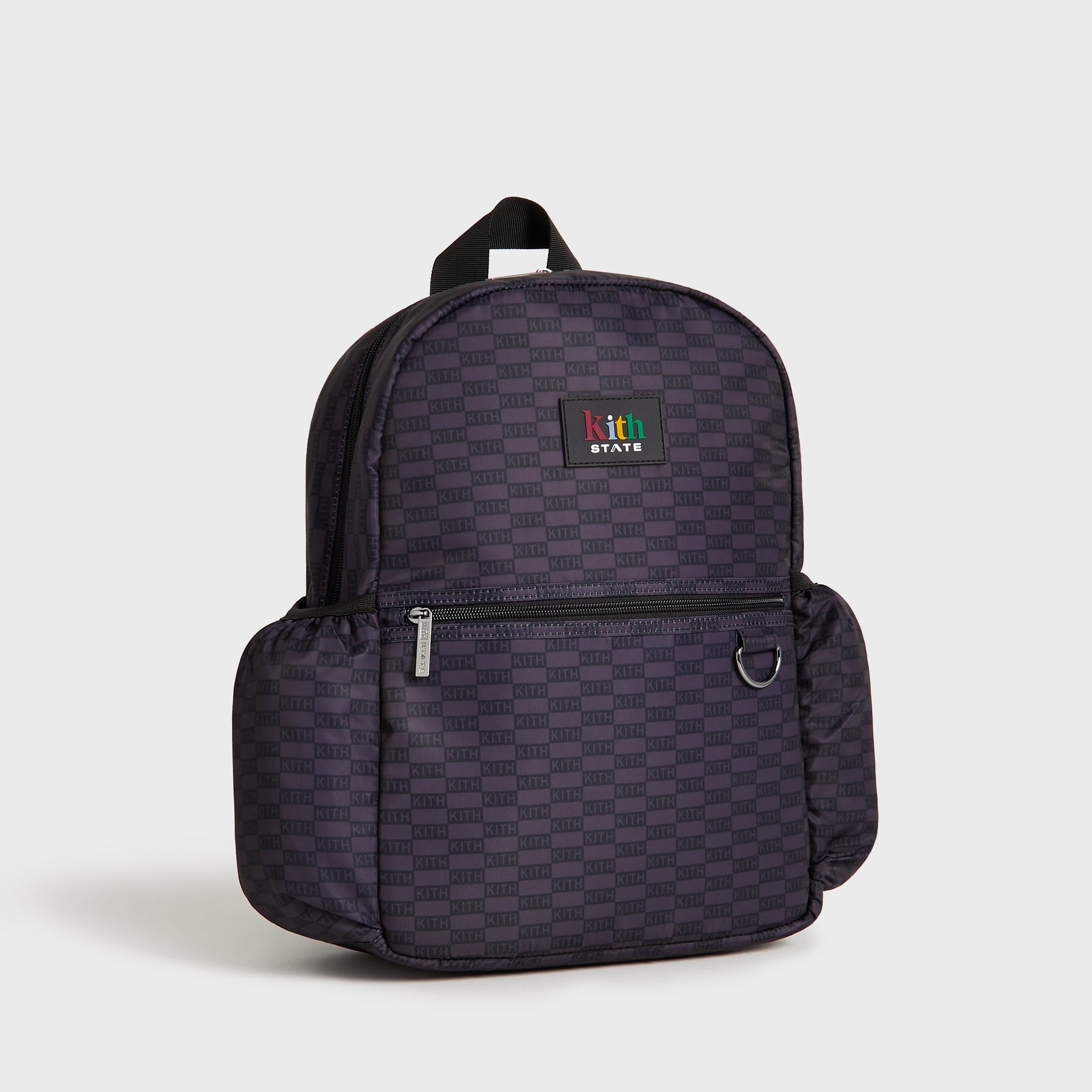 Kith Kids for STATE Kane Backpack in black KITH monogram, angled three-quarter front view