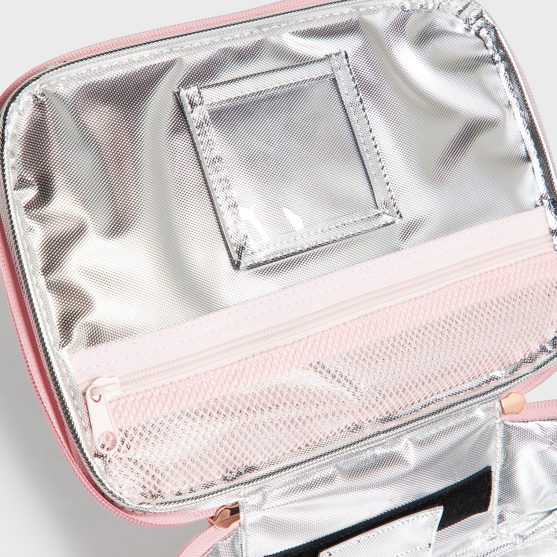 Interior detail of Bloom Rodgers Lunch Box with silver insulated lining and clear mesh pockets