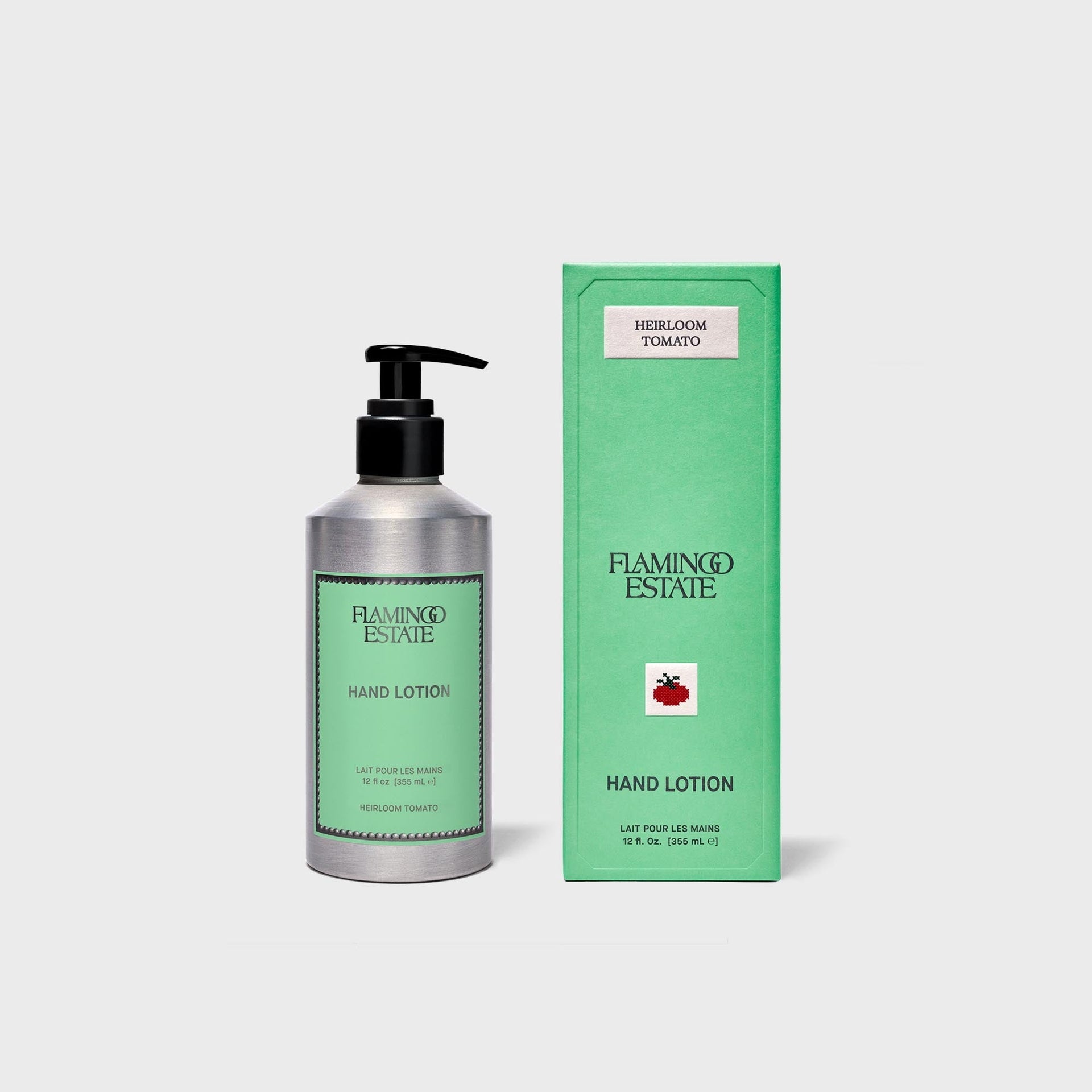 Flamingo Estate Heirloom Tomato hand lotion, silver pump bottle beside green box with tomato motif