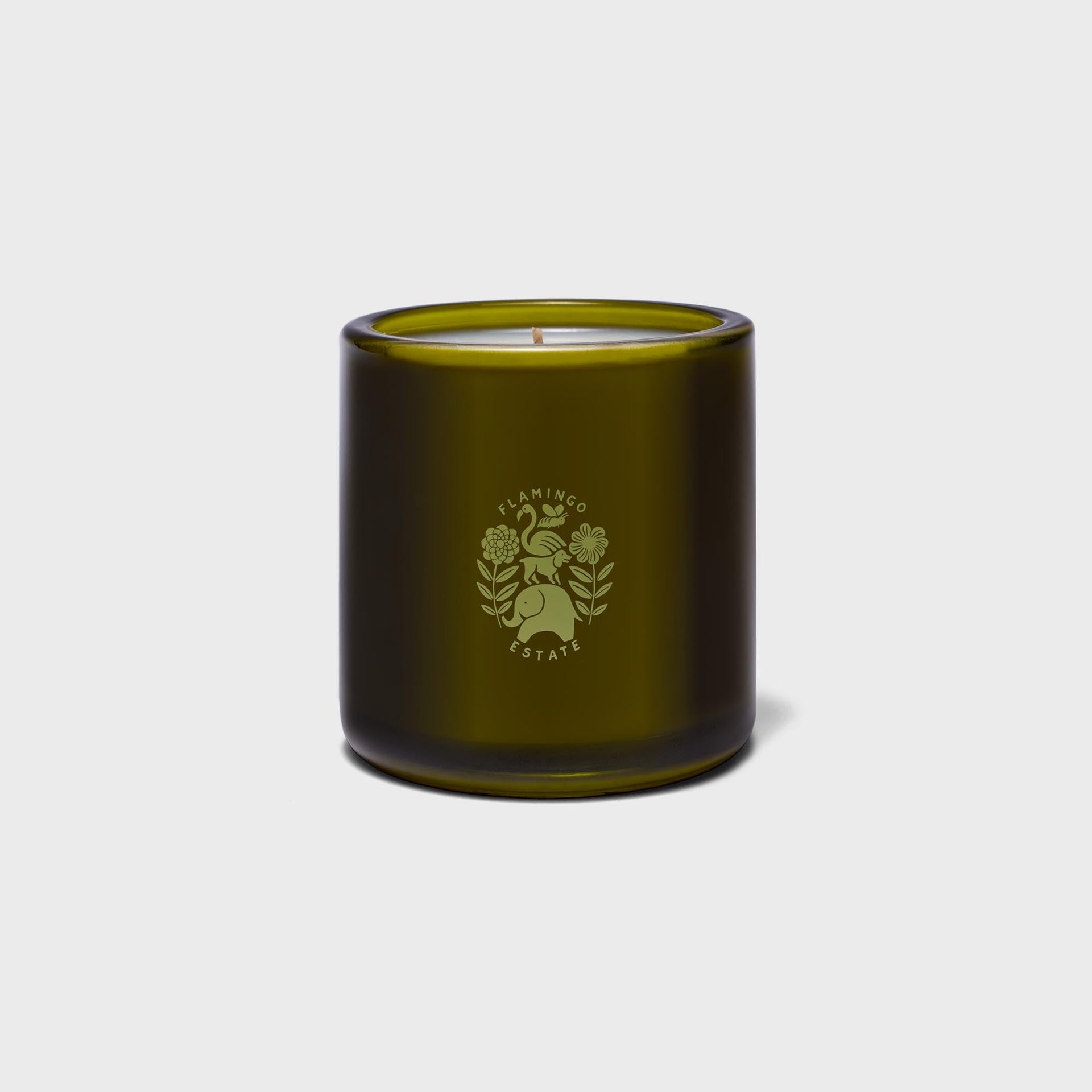 Flamingo Estate Green Goddess candle in olive-green glass jar with single wick and elephant crest logo, front