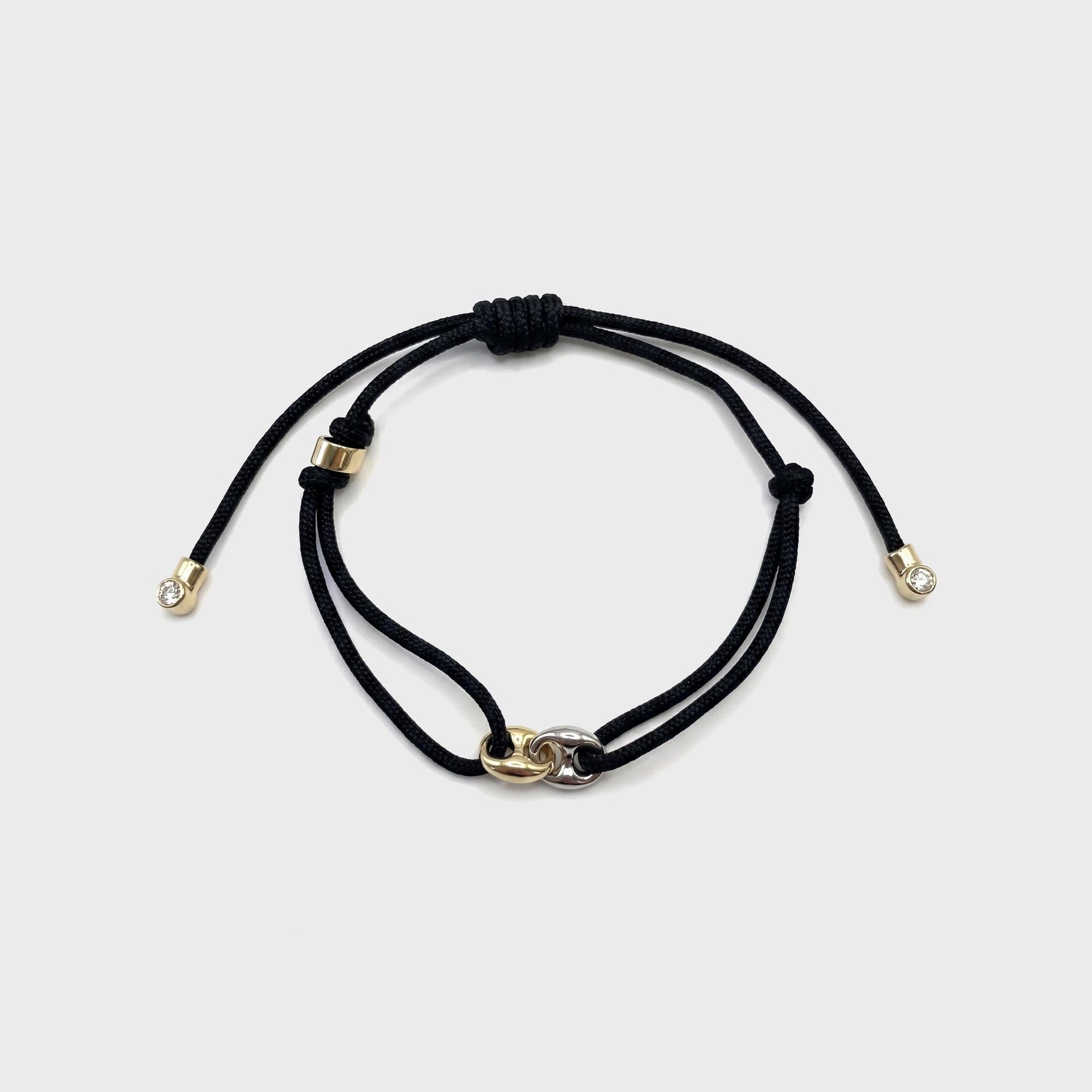 Greg Yuna Double Mariner adjustable black cord bracelet with gold and silver interlocking clasp charm and diamond-tip ends