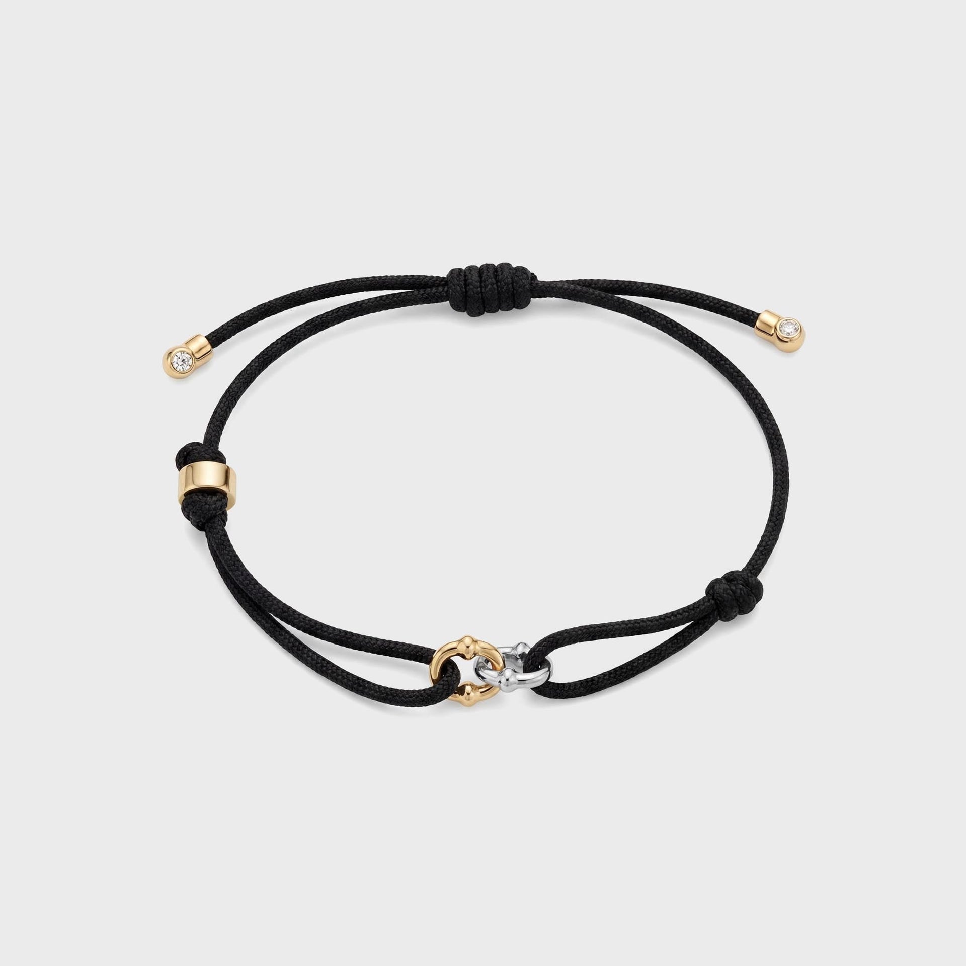 Greg Yuna Double Umlaut adjustable black cord bracelet with gold and silver linked charm and diamond-tip ends