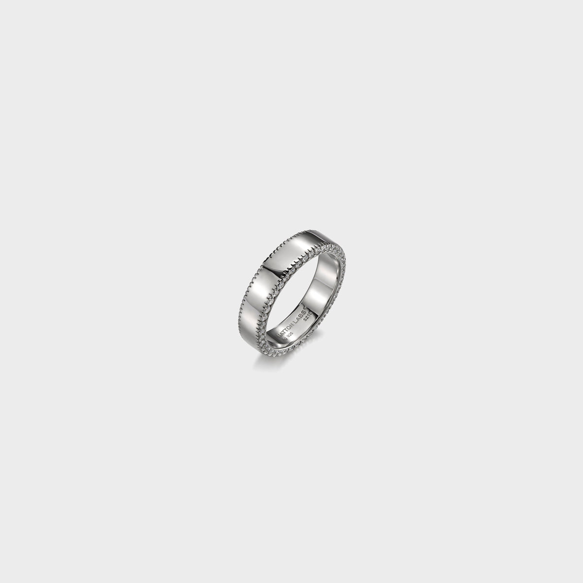 Hatton Labs Infinity Ring in sterling silver, angled view showing polished band, engraved interior and sparkling edge stones