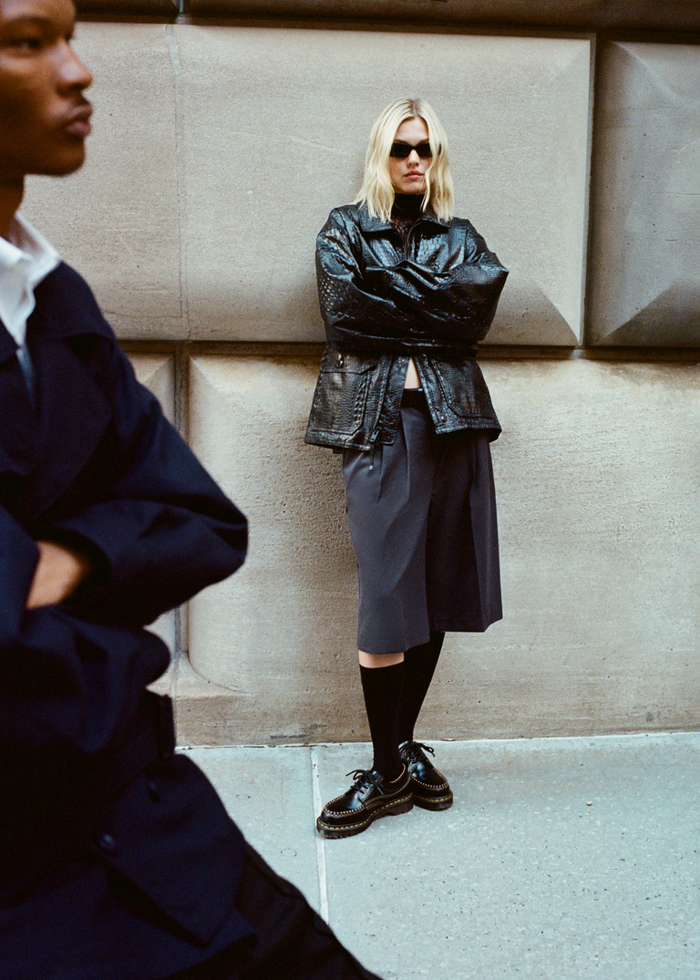 
            A model wearing the Dr. Martens Lowell shoe.
          
